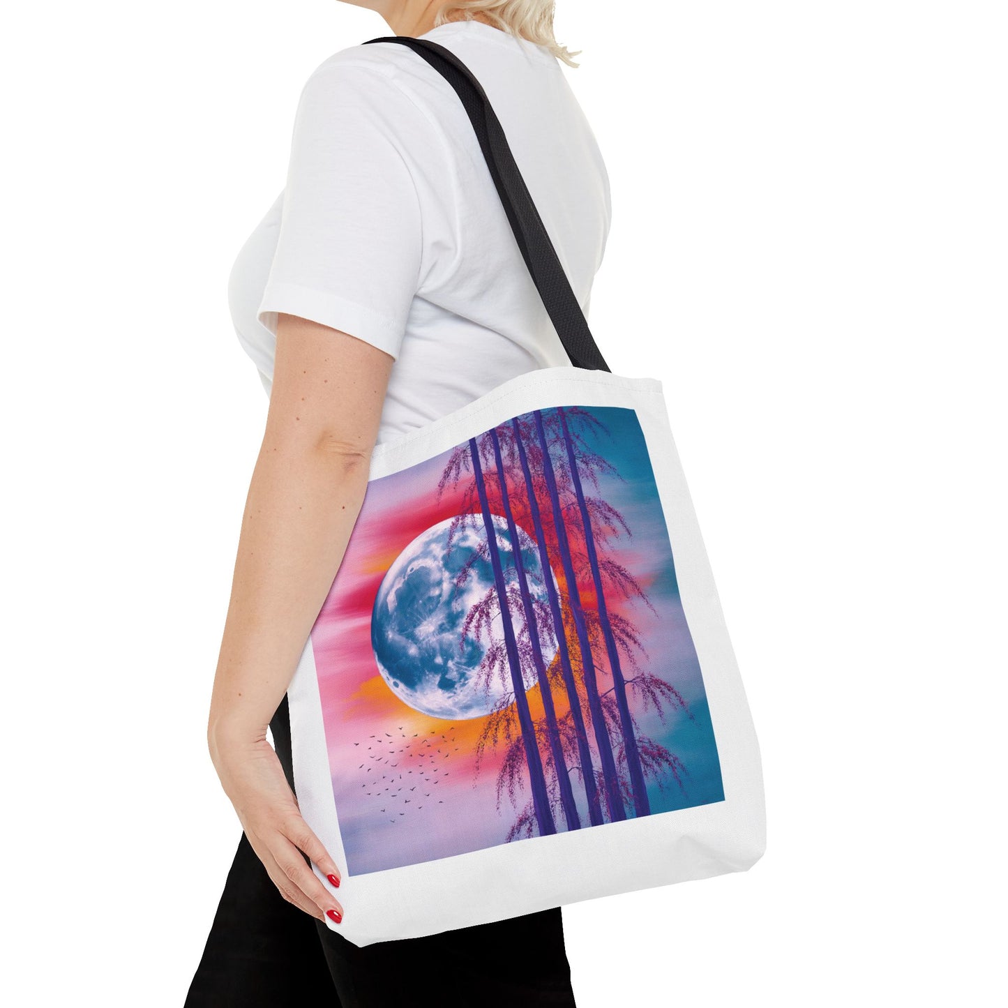 Moonlit Landscape Tote Bag: A striking tote featuring a vibrant full moon scene with silhouetted trees against a fiery sunset, perfect for nature lovers and art enthusiasts seeking stylish, joyful accessories.