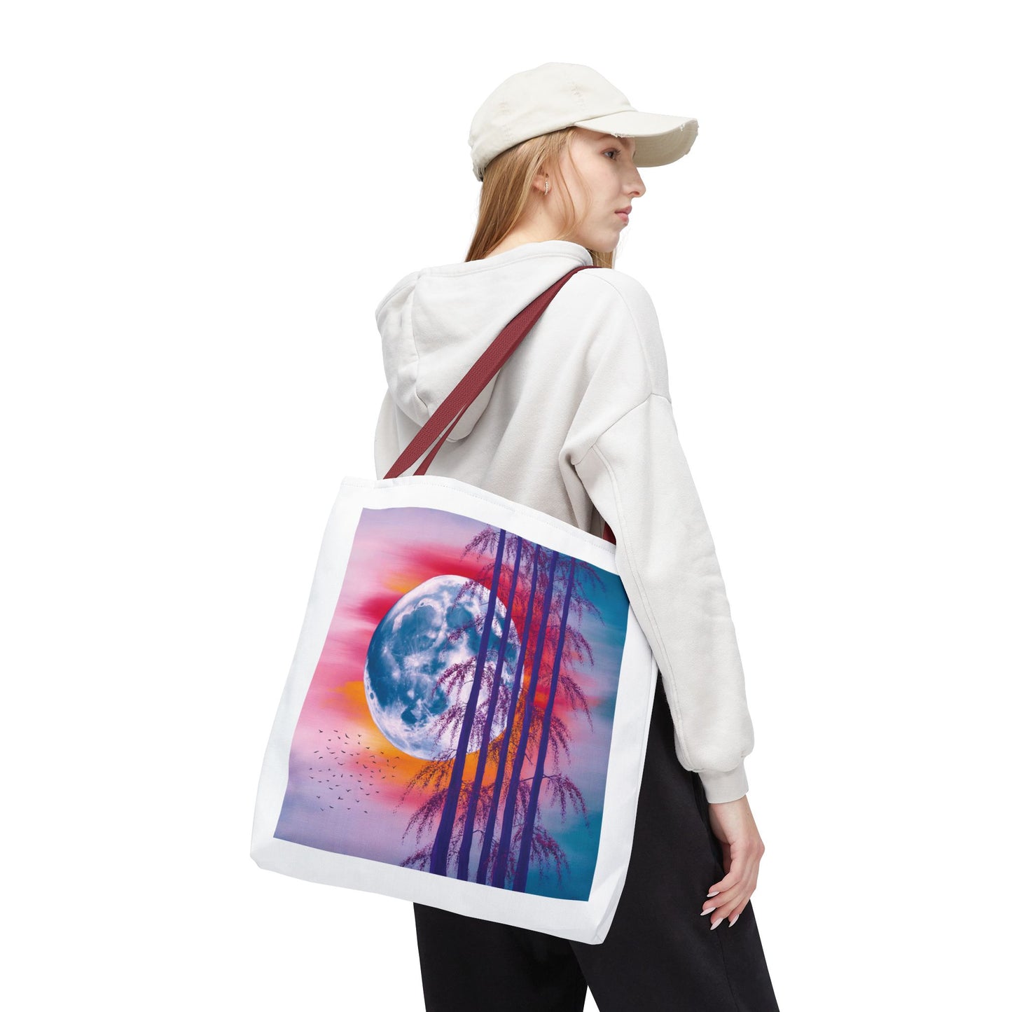 Moonlit Landscape Tote Bag showcasing a vibrant full moon and silhouetted trees against a sunset sky, embodying an artistic, celestial vibe, perfect for nature lovers and art enthusiasts.