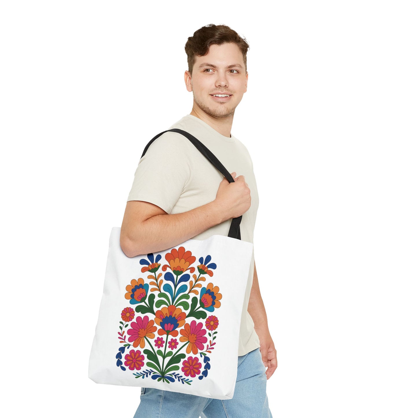 Red Folk-Art Floral Tote Bag featuring a vibrant, folk-art floral pattern with red, blush, and blue blooms, accented by green leaves. Ideal for carrying essentials, embodying FireBrook Essentials' joyful and uplifting design ethos.