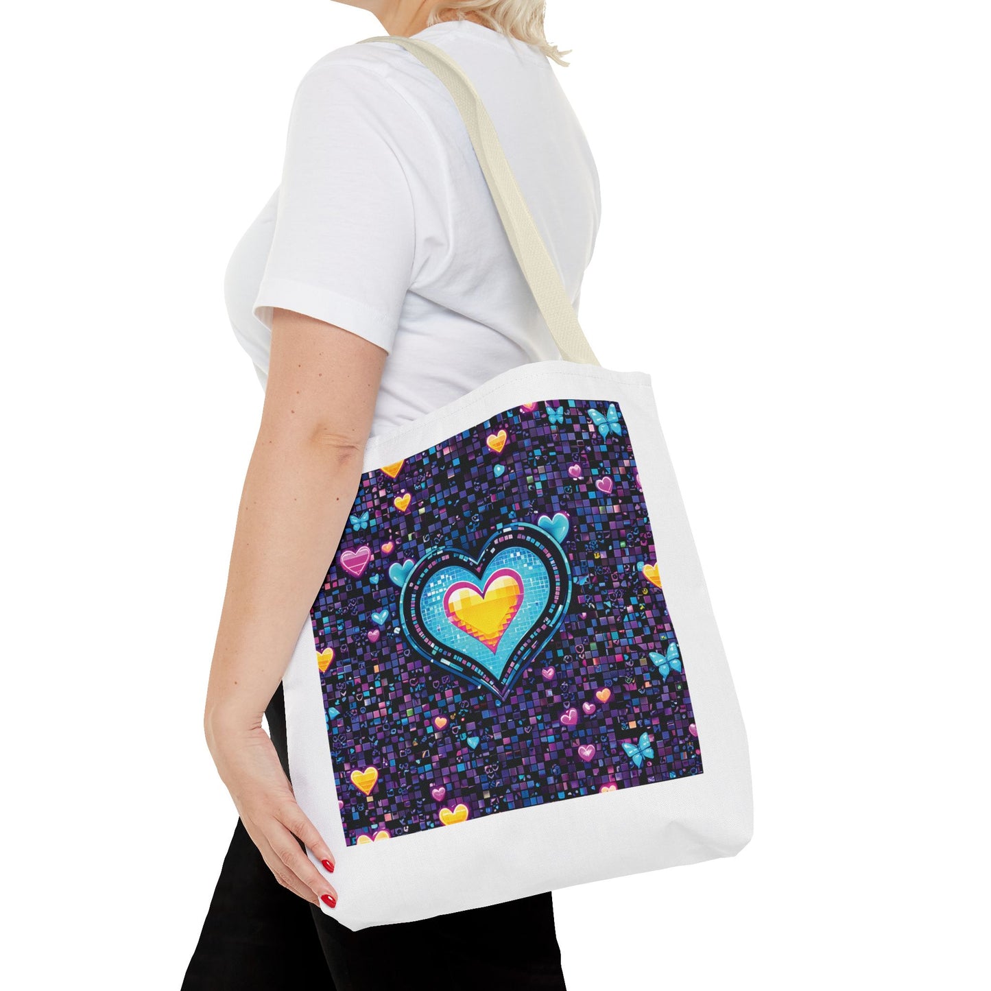 Woman holding Heart Pixelated Nostalgic Cyber-Aesthetic Tote Bag, featuring pixelated hearts and butterflies. Perfect for adding a unique, stylish touch to everyday outfits.