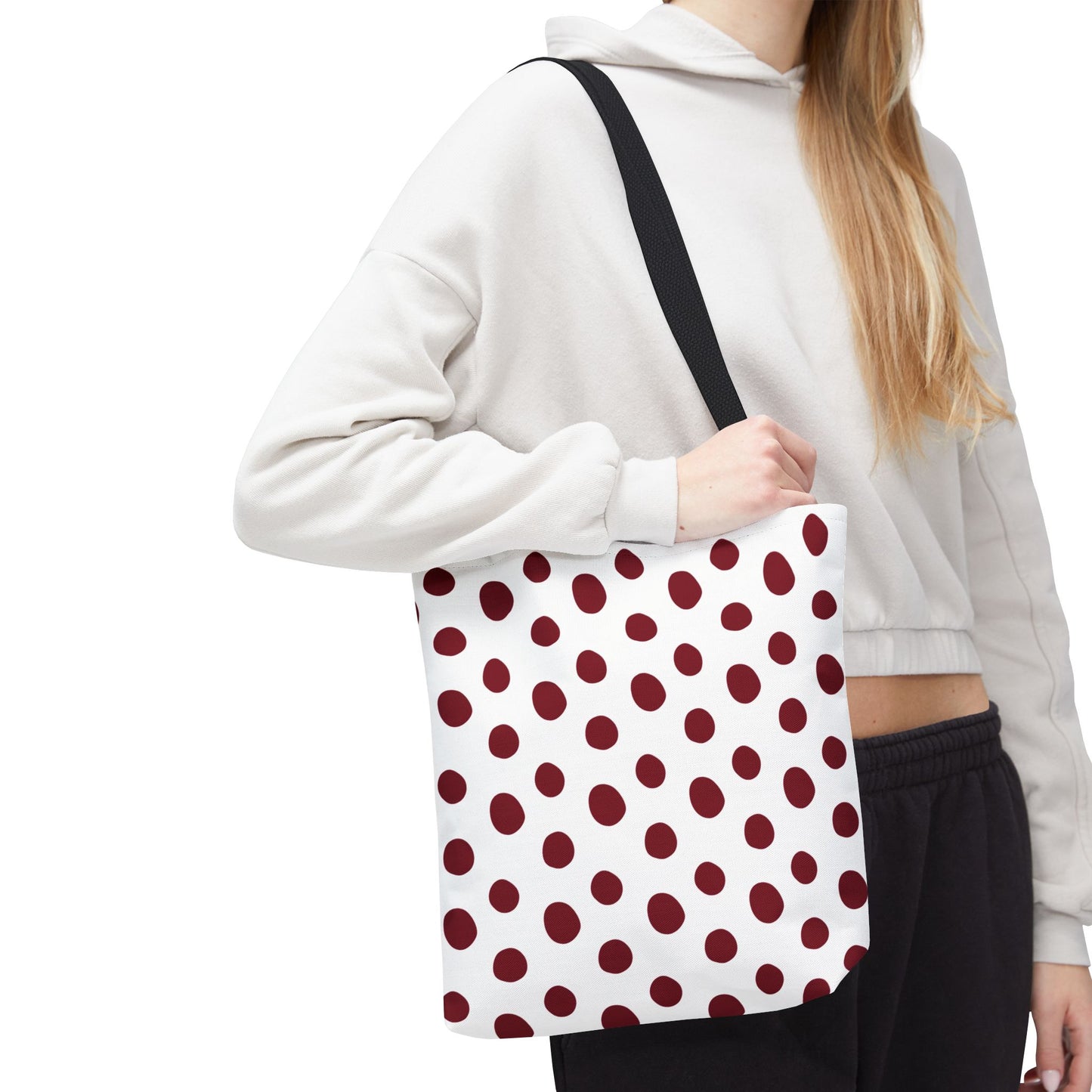 Burgundy Polka Dots Tote Bag showcased close-up, highlighting its stylish design and durable 100% polyester fabric. Ideal for everyday use, it features reinforced handles and boxed corners for structure, embodying FireBrook Essentials' commitment to joyful, functional design.