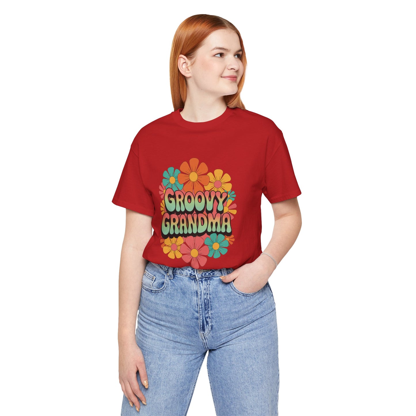 Groovy Grandma for Mother's Day Bella+Canvas Unisex T-Shirt showcasing a vibrant floral design, ideal for vintage-loving grandmas. The model pairs it with casual jeans, embodying FireBrook Essentials’ joyful style.