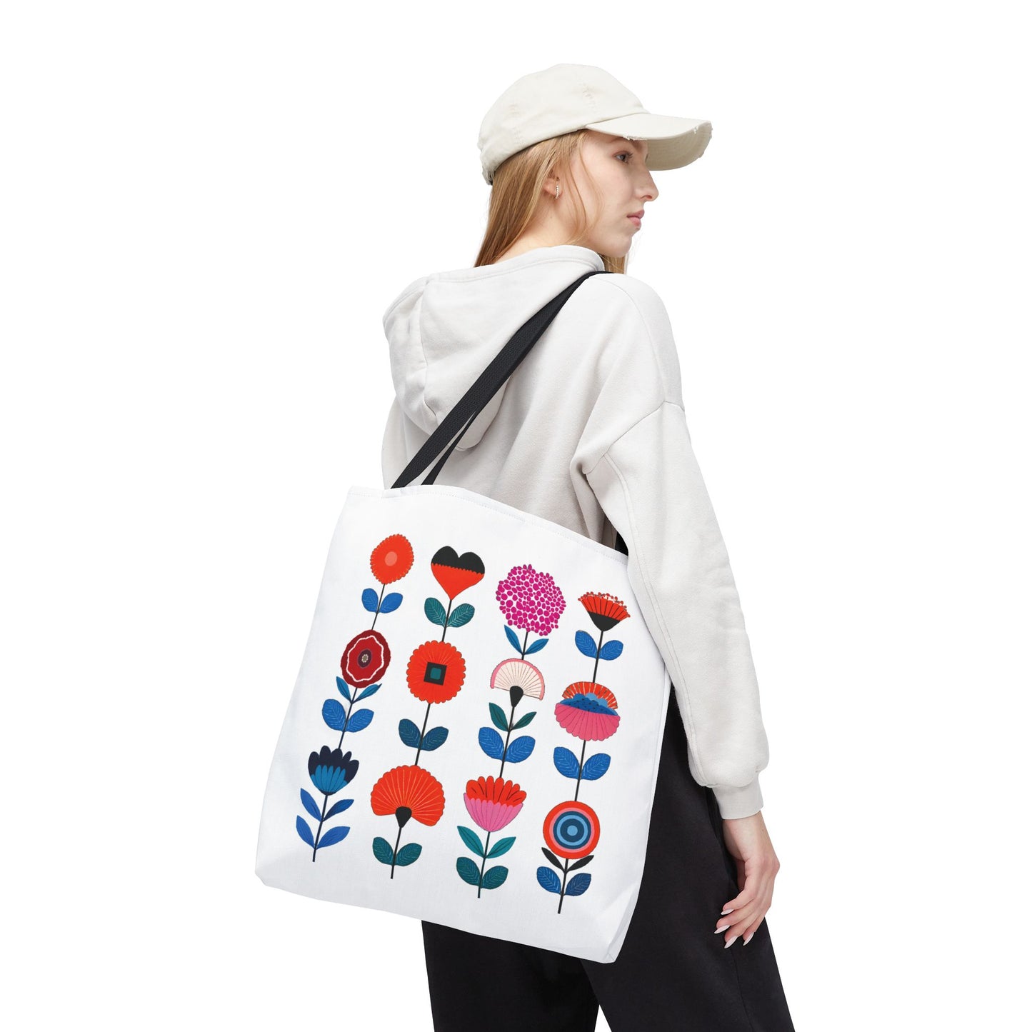 Floral Pattern Tote Bag featuring colorful flowers, perfect for daily errands, shown on a woman wearing a white hat and sweatshirt.