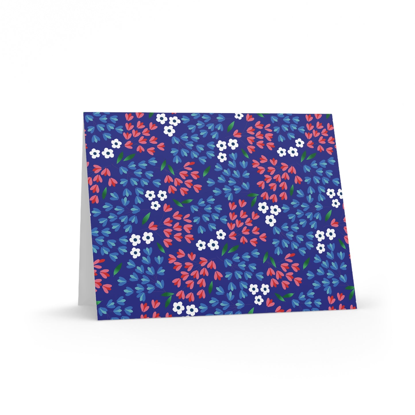 Floral Wildflower Greeting Cards — Pack of 8/16/24, featuring a vibrant, stylized floral pattern with navy blue background, white blooms, red petals, and green leaves; blank inside with a matching white envelope.