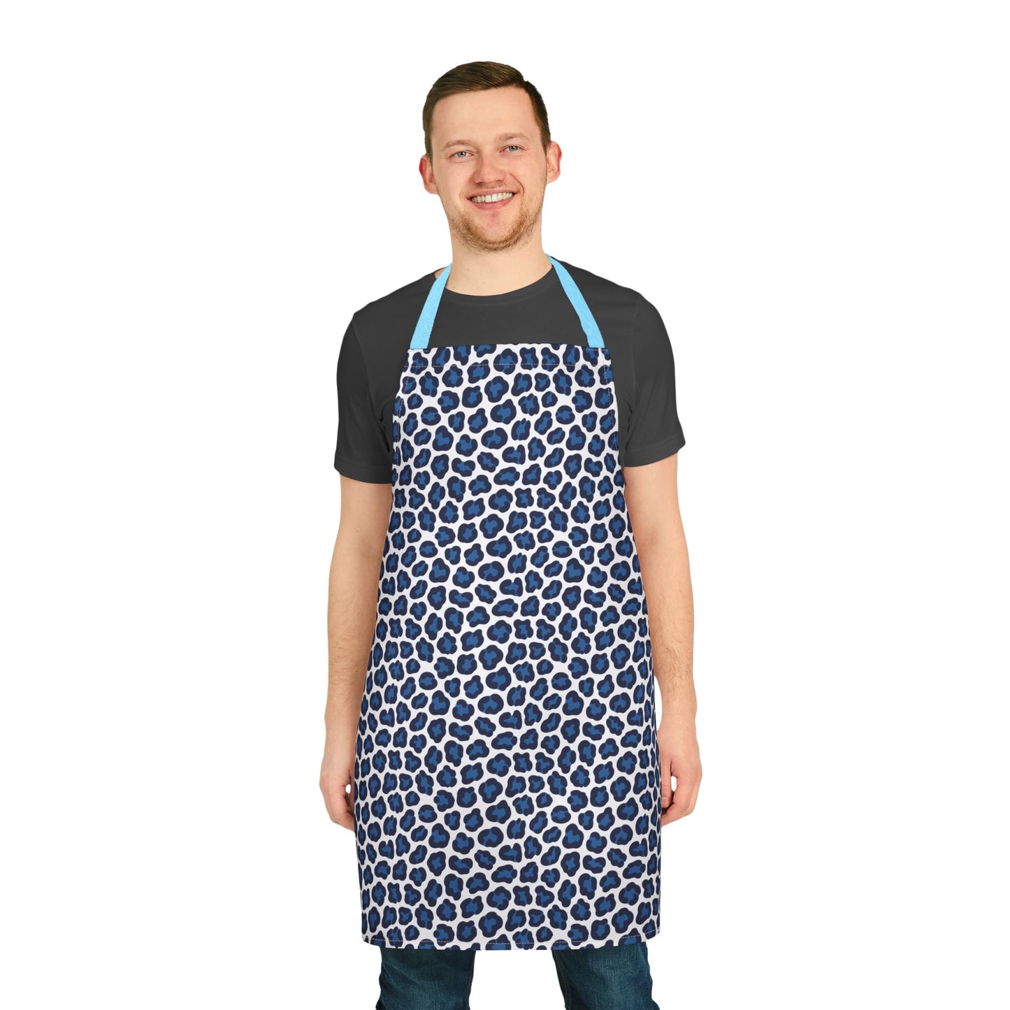 Apron, Cheetah Print: A stylish apron with a blue cheetah pattern, seen on a smiling man. Designed for comfort, it’s perfect for cooking or crafting, embodying FireBrook Essentials' joyful, uplifting style.