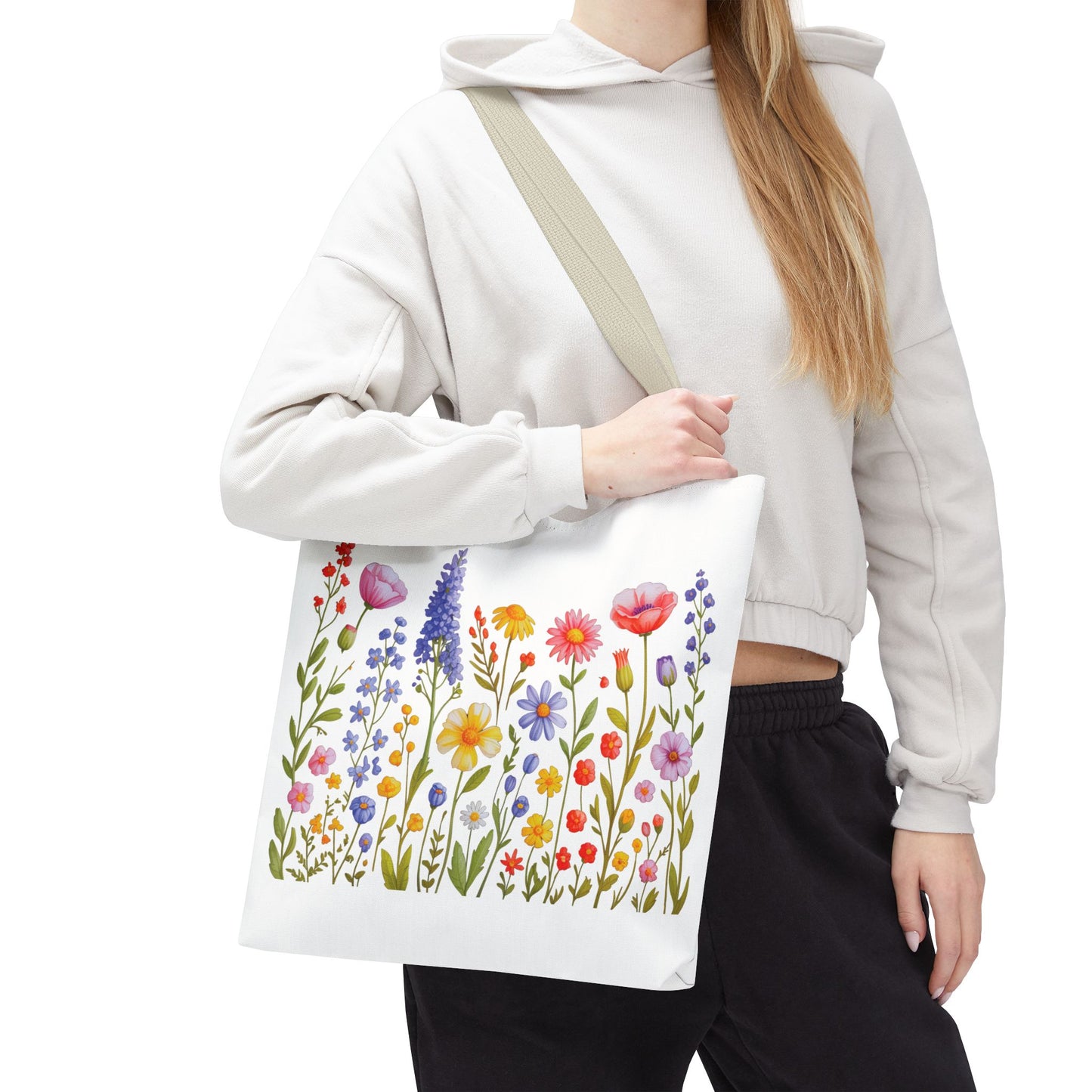 Wildflowers Tote Bag featuring a vibrant wildflower design, embodies a natural, free-spirited vibe. Ideal for nature lovers, this durable polyester bag suits everyday use with reinforced handles and spacious boxed corners.