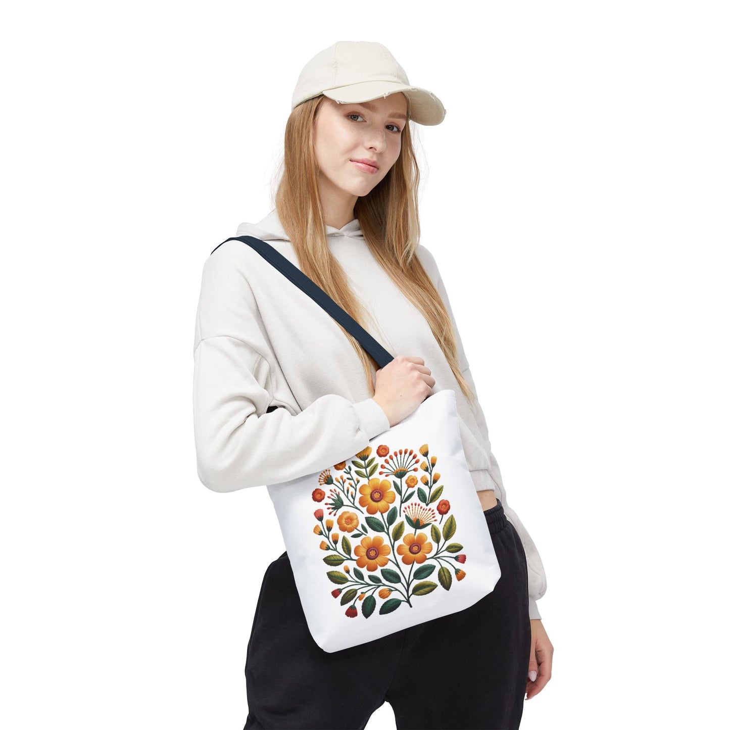 Folk Art Floral Faux Embroidery Style Tote Bag showcases a vibrant faux embroidery design with mustard and sunflower florals, olive leaves, and coral accents, embodying a relaxed, artistic vibe. Ideal for stylish, joyful daily use.
