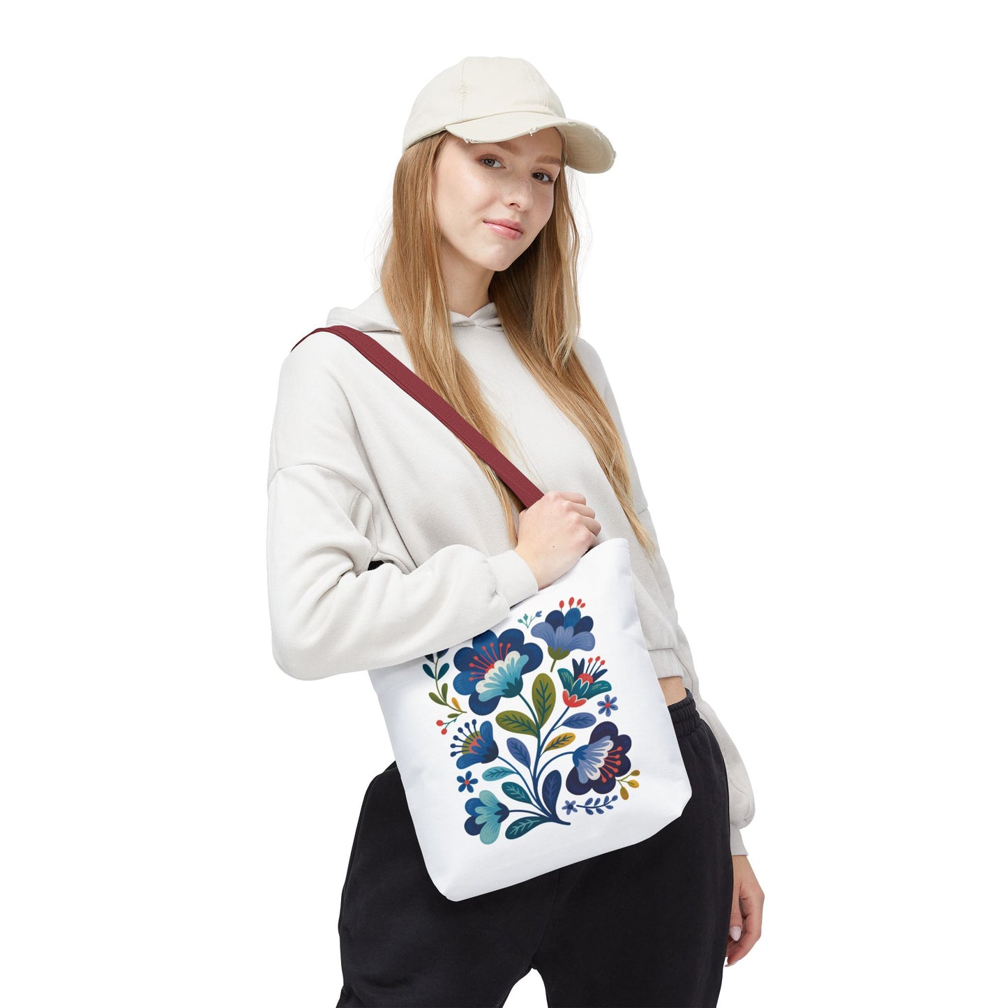 Vintage Folk Art Design Blue Floral Tote Bag showcasing intricate blue floral patterns, perfect for adding charm to daily wear or special occasions, reflecting FireBrook Essentials' commitment to uplifting, unique style and joy.