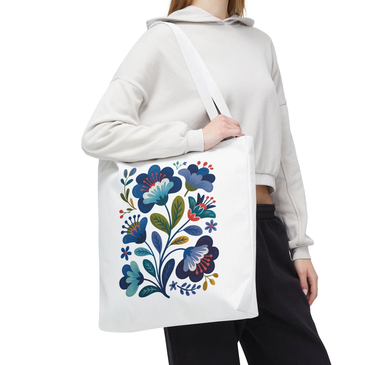 Vintage Folk Art Design Blue Floral Tote Bag with charming blue floral patterns, reinforced black-stitched handles, and boxed corners for extra space, offering a nostalgic and stylish touch for any occasion.
