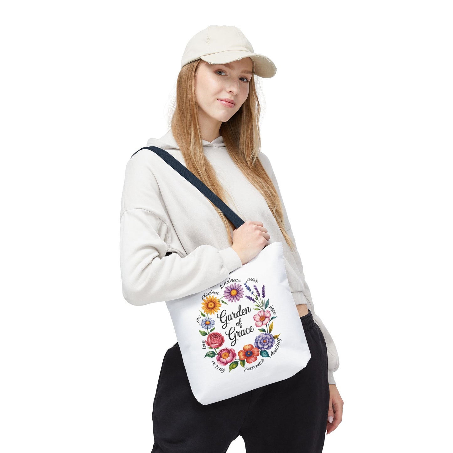 Garden of Grace Watercolor Design Tote Bag showcasing hand-drawn flowers with pastel petals and elegant script. Ideal for nature lovers, this versatile tote from FireBrook Essentials adds charm to everyday use.