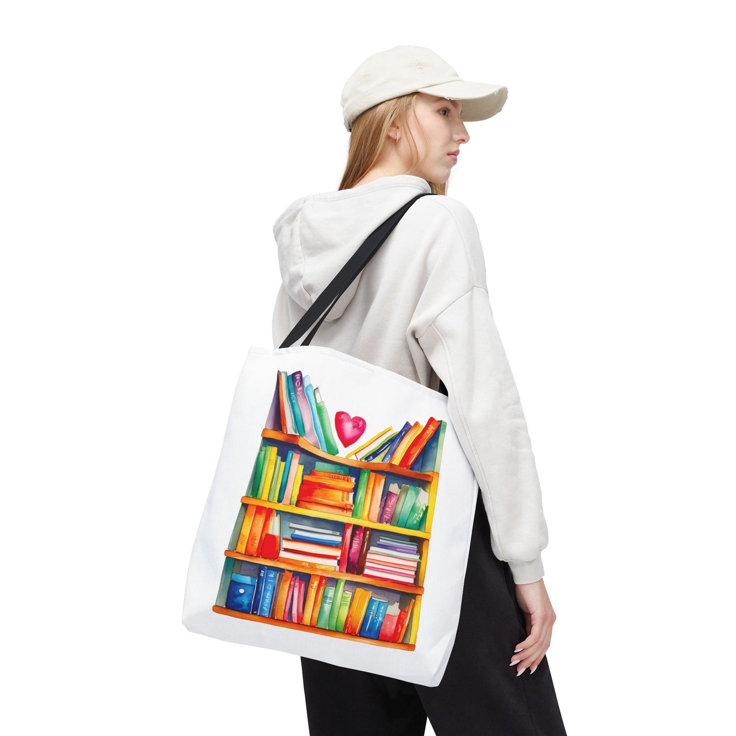 Books Tote Bag - 100% Spun Polyester, featuring a bookshelf pattern, worn by a woman with a white hat and sweatshirt, showcasing its durability and style.
