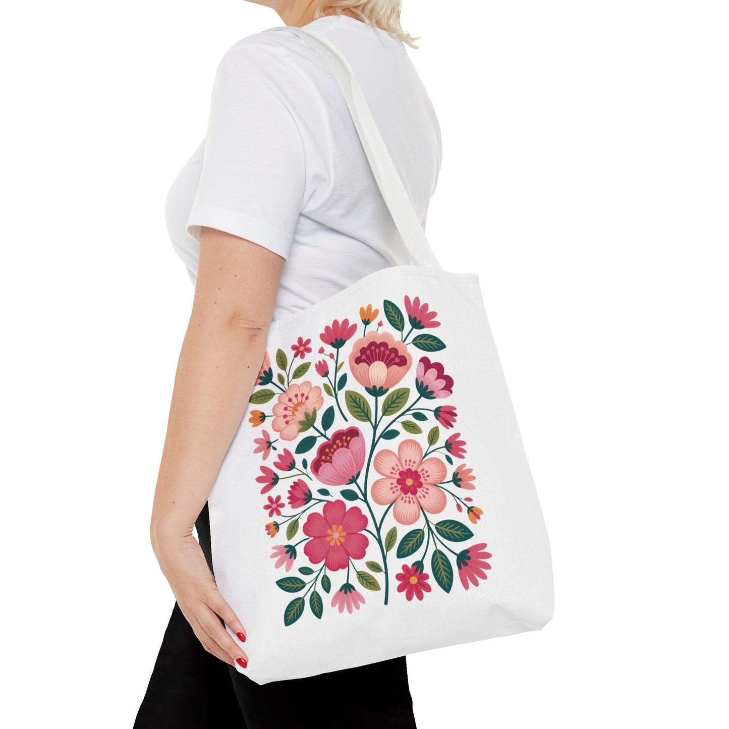 Pink Floral Folk-Art Style Tote Bag featuring vibrant pink flowers and green leaves with navy or orange accents. Ideal for carrying essentials, this tote embodies FireBrook Essentials' uplifting, joyful design ethos.