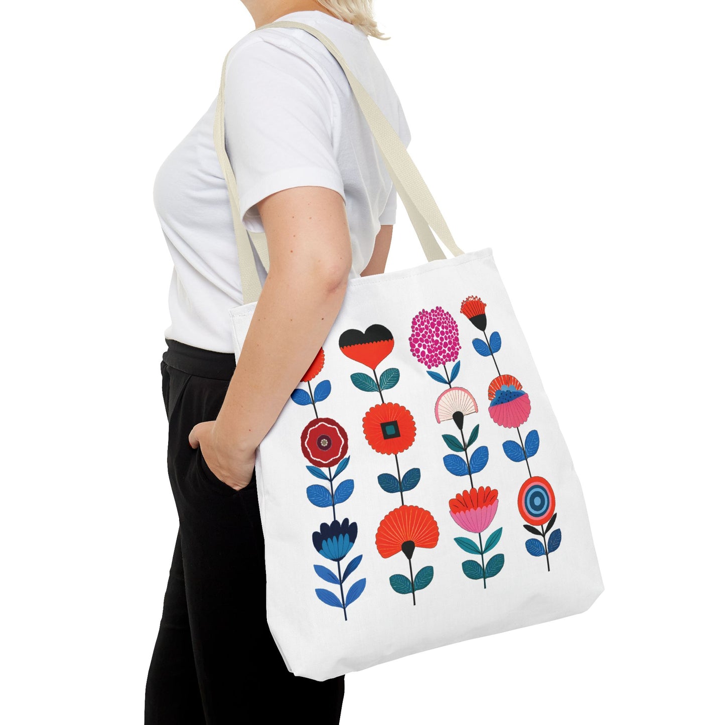 Woman holding a Floral Pattern Tote Bag with colorful flowers, ideal for versatile use, reflecting FireBrook Essentials' stylish and practical design ethos.