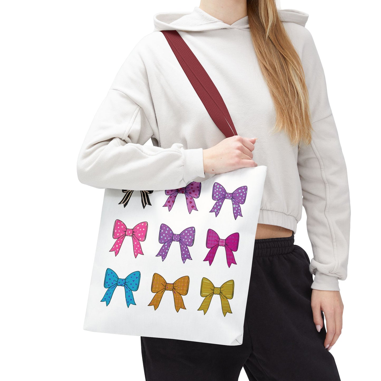 Woman holding the Bows Ribbons Tote Bag, featuring stylish bow patterns, ideal for fashion lovers seeking a practical, spacious, and trendy carry-all.