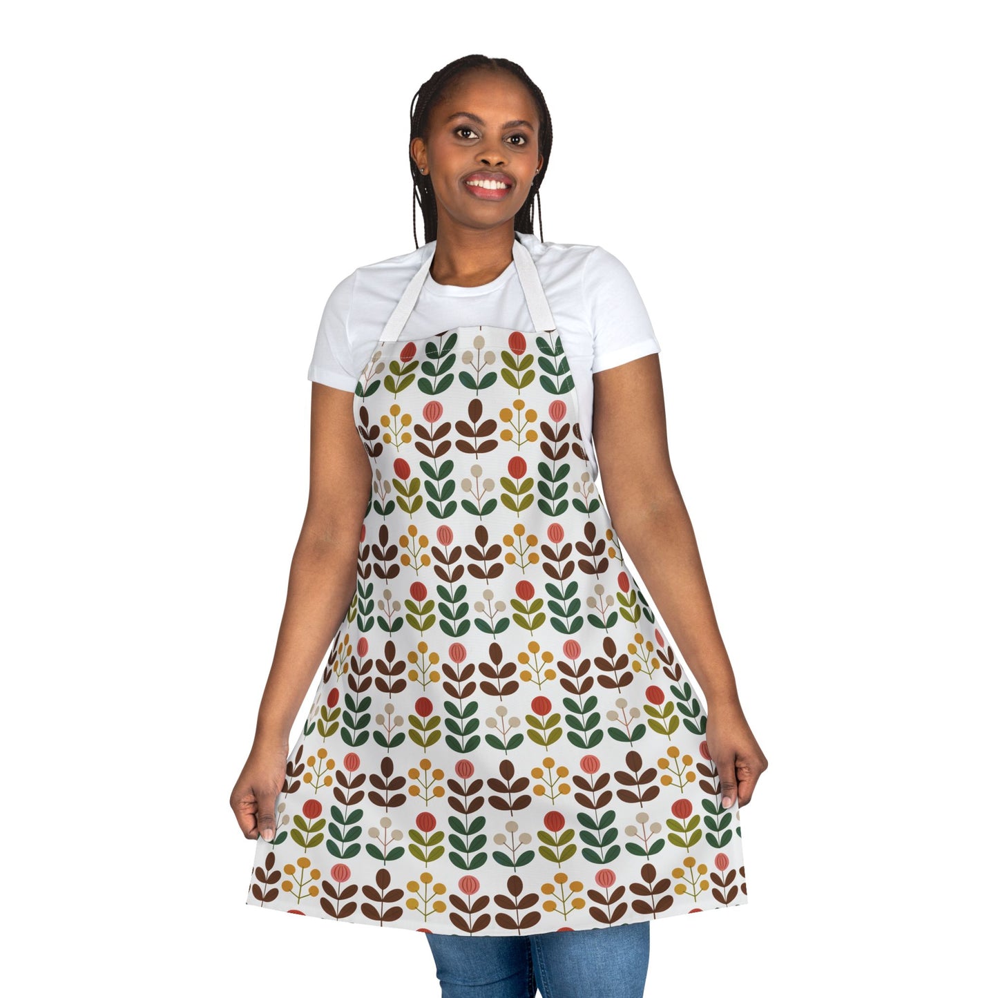 Flower Pattern Apron: Close-up of a smiling woman wearing a white shirt and apron, showcasing vibrant floral patterns perfect for creative pursuits, ideal for enhancing joy in kitchens or studios.