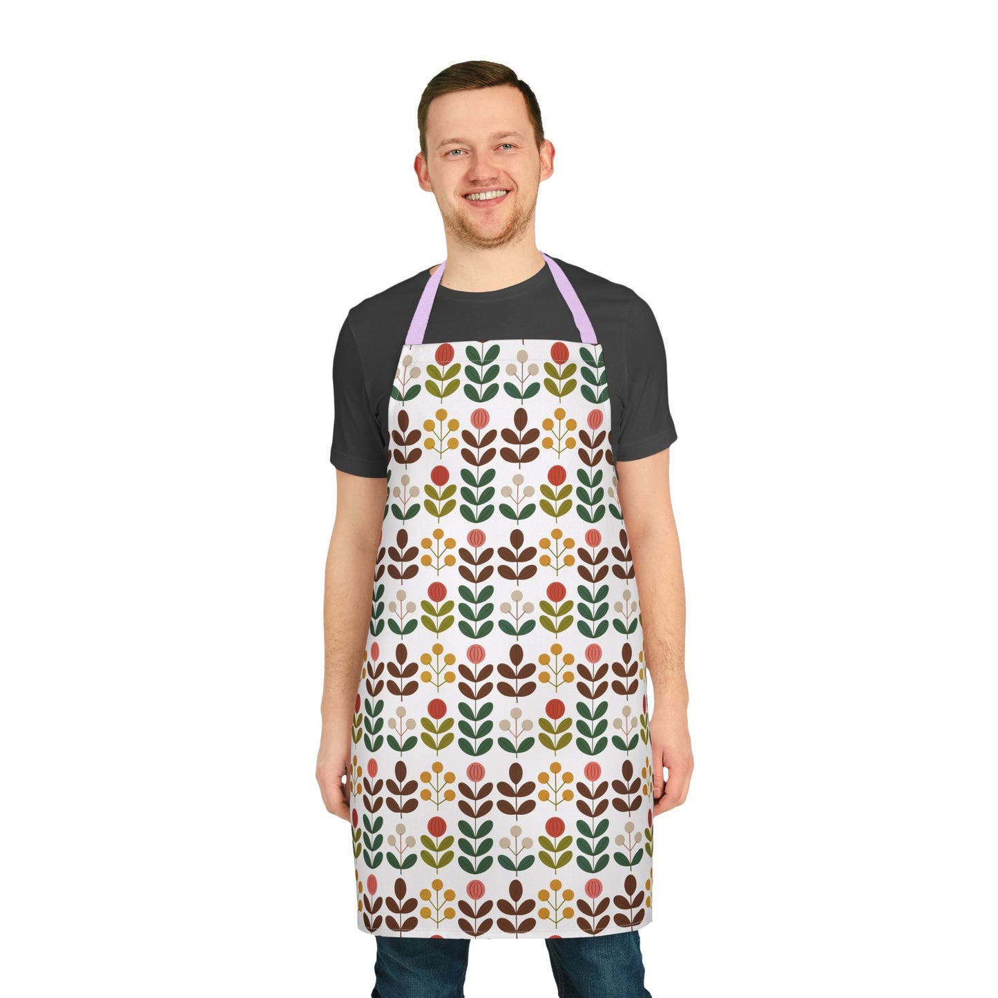 Flower Pattern Apron features a vibrant floral design perfect for creative cooks or artists. Worn by a smiling man, this apron adds a joyful touch to kitchen or studio activities.