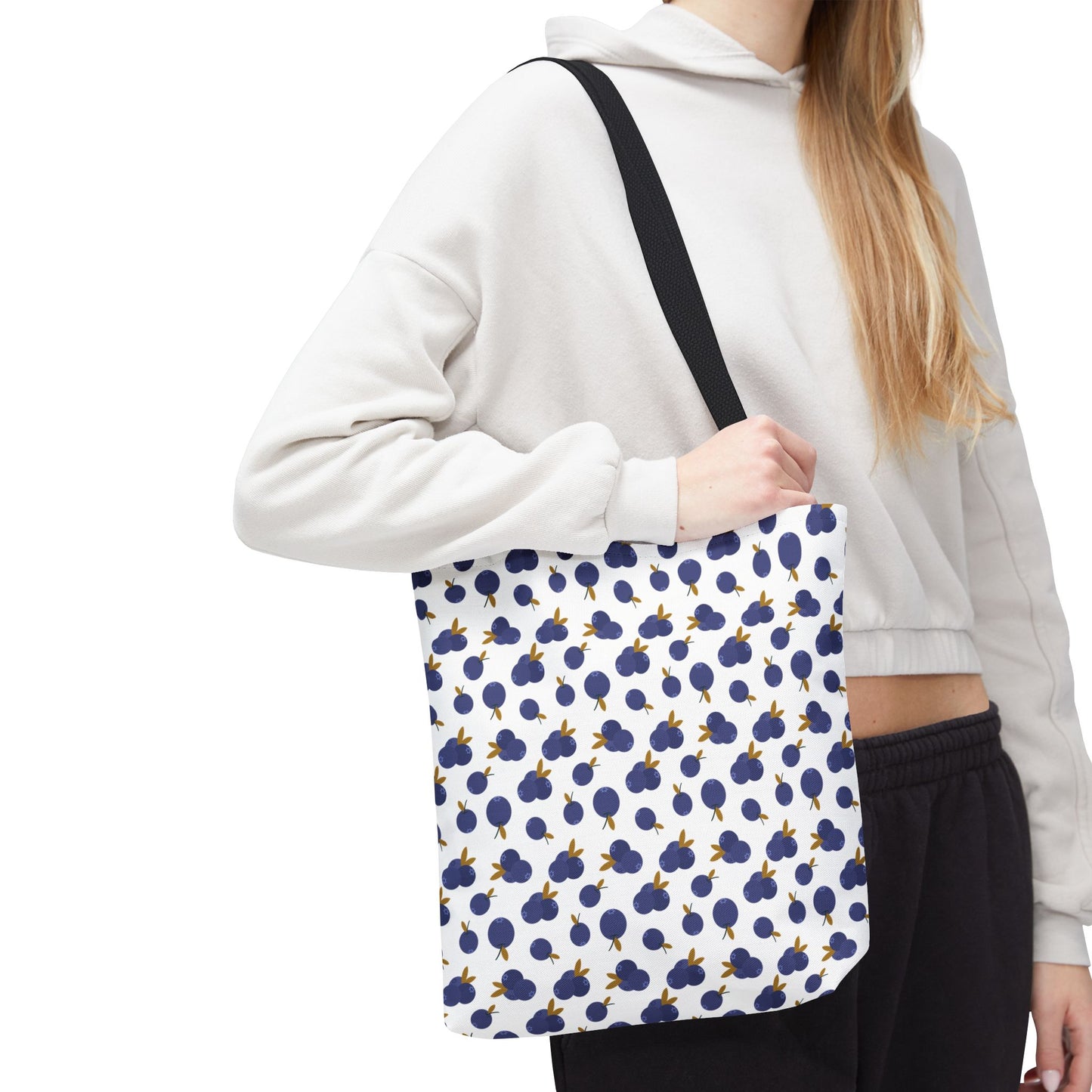 Blueberry Tote Bag with a charming blueberry pattern, featuring durable polyester, reinforced handles, and boxed corners. Available in multiple sizes, it's perfect for carrying essentials with style and functionality.