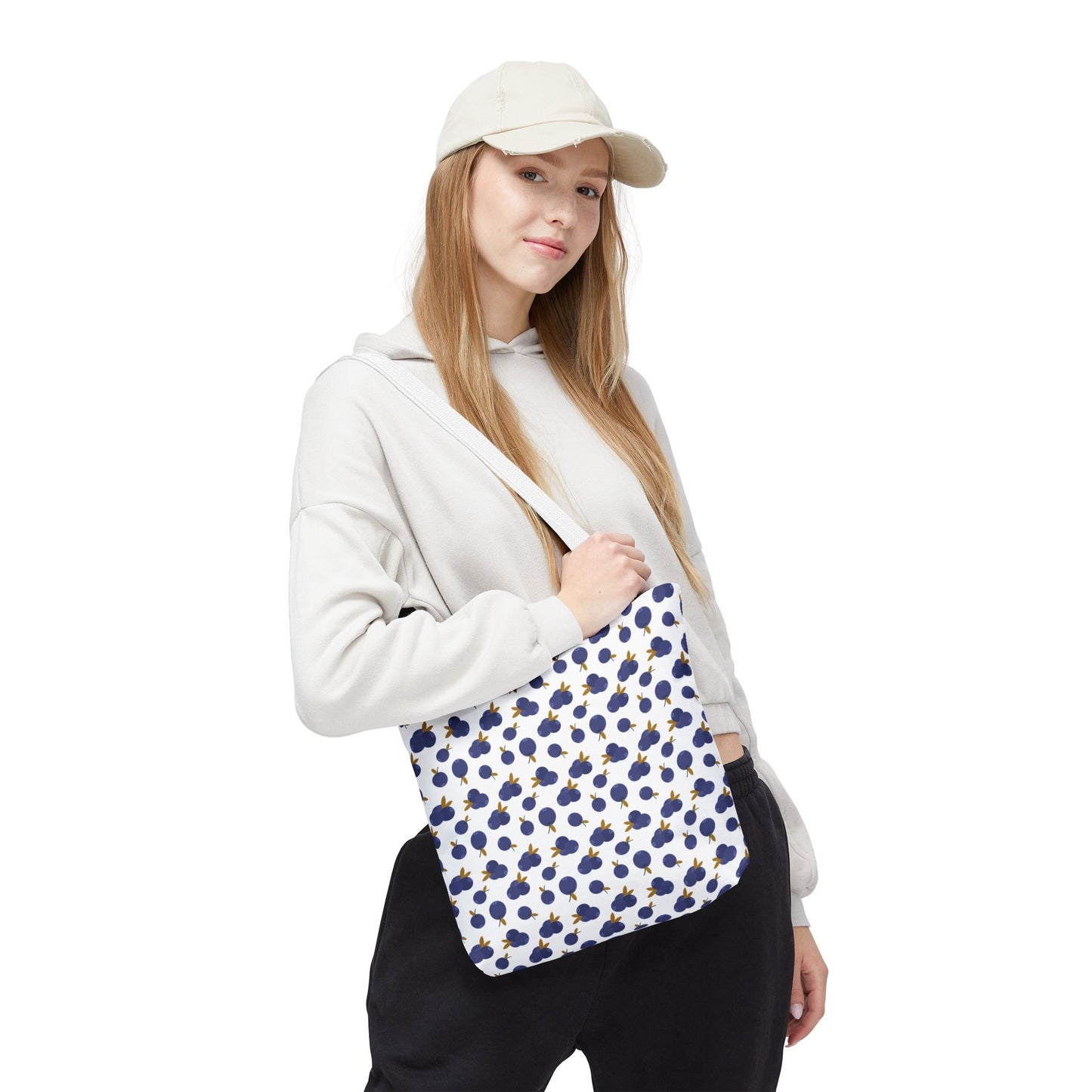 Blueberry Tote Bag showcasing a charming blueberry pattern, crafted from durable polyester with reinforced handles and boxed corners, ideal for carrying essentials with style and practicality.