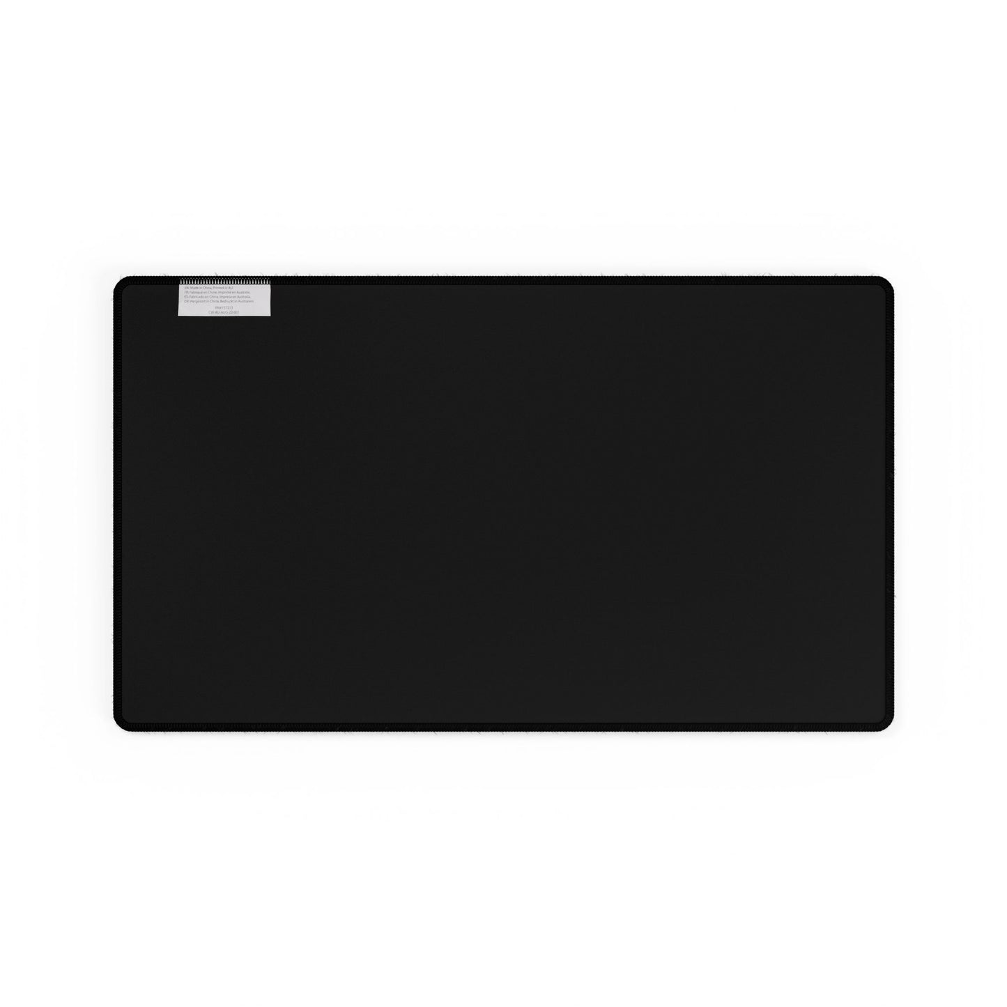 Blue Floral Desk Mat, a large black surface with a subtle instruction label, crafted for smooth mouse gliding, elegantly combines hand-drawn blue florals to enhance your workspace with style and joy.