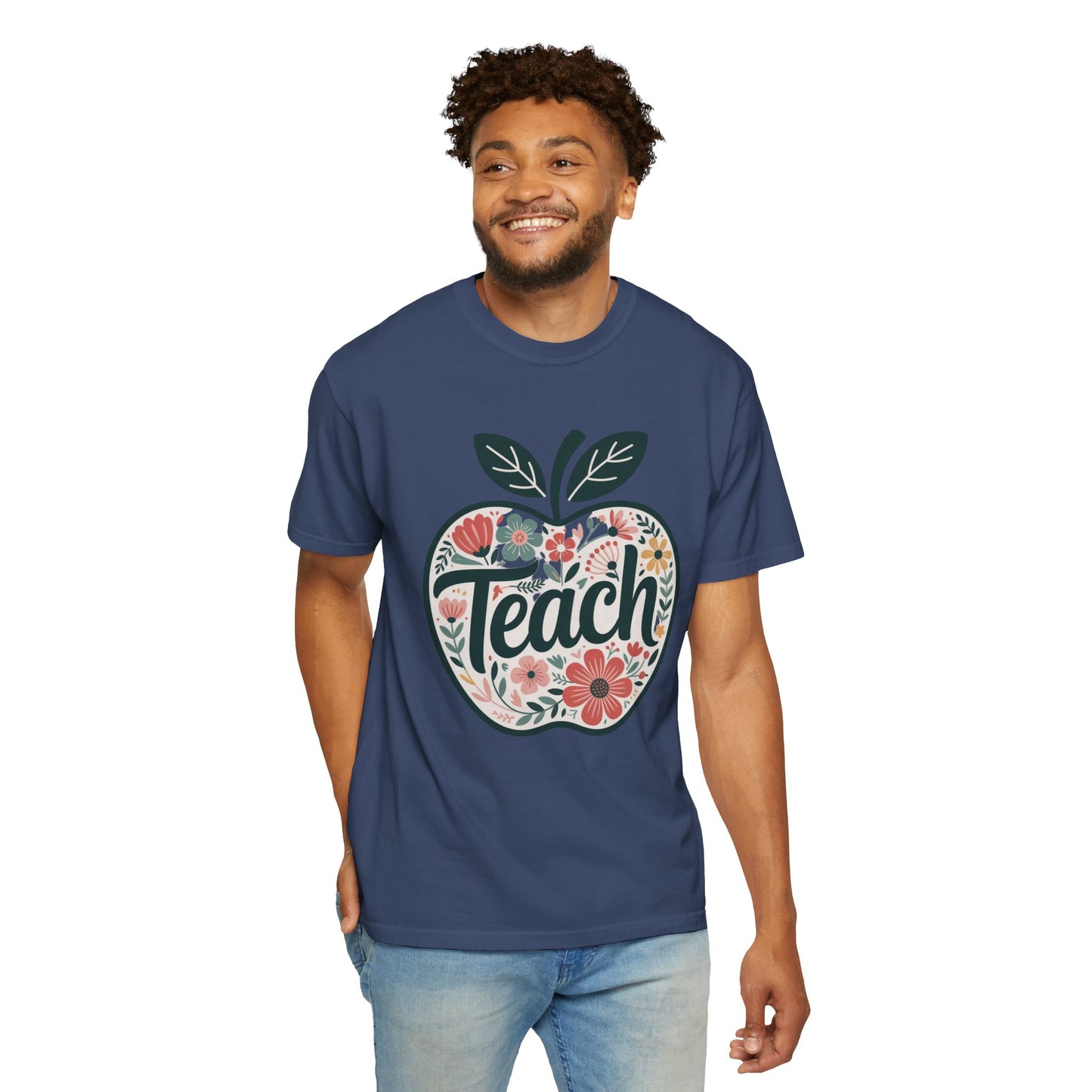 Floral Apple TEACH T-shirt features a hand-drawn apple with pastel florals and TEACH overlay, embodying FireBrook Essentials' uplifting, stylish approach for educators and nature lovers.