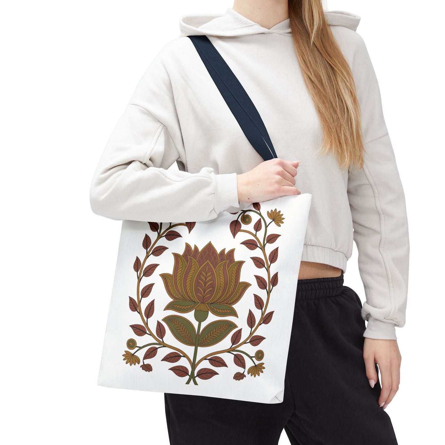 Earth Tote Bag with Floral Vines and Traditional Motifs held by a woman, showcasing its unique, detailed pattern and spacious design, perfect for stylishly carrying essentials.