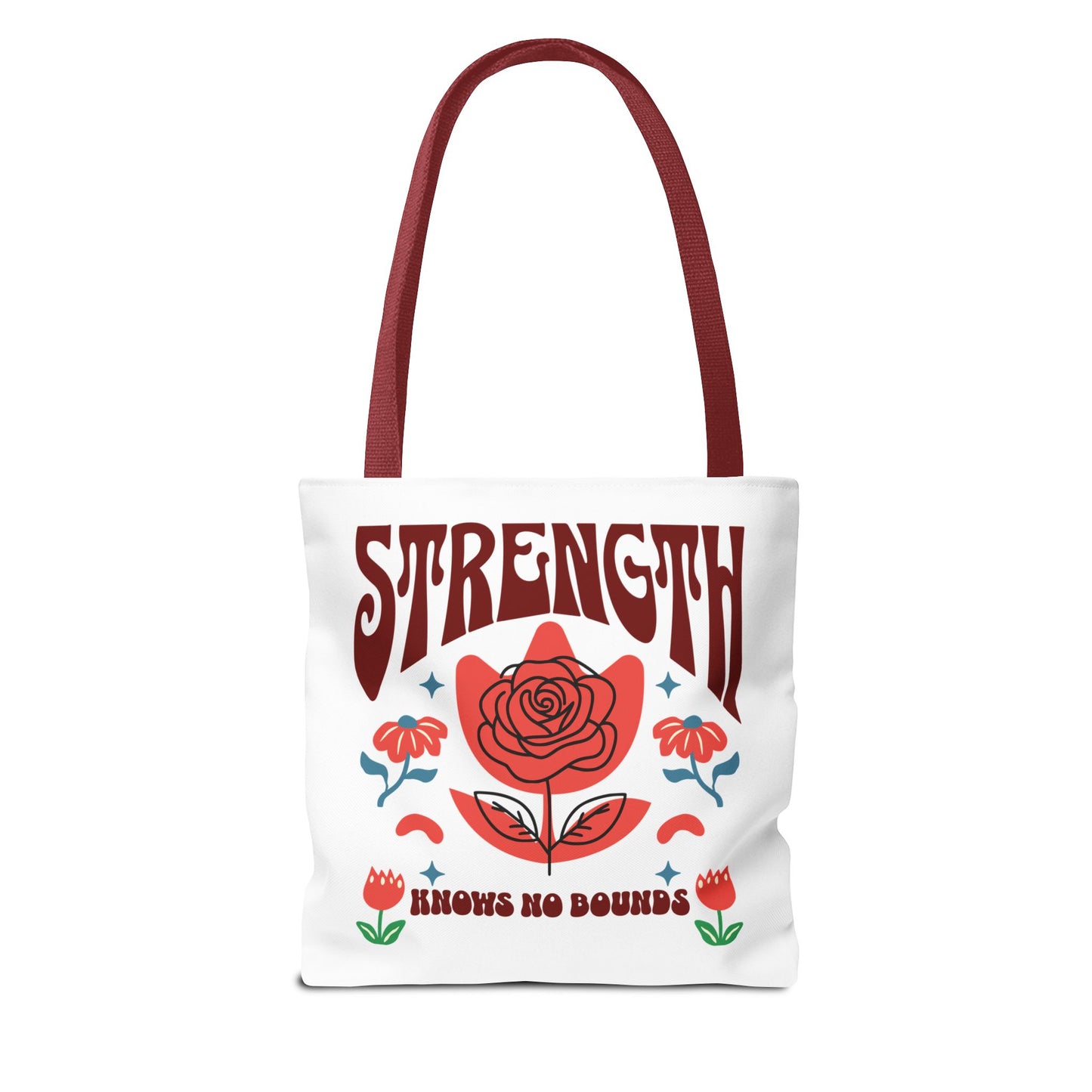 Strength Knows No Bounds Tote Bag, white with red text and floral design, featuring durable red handles and spacious boxed corners. Perfect for everyday use.