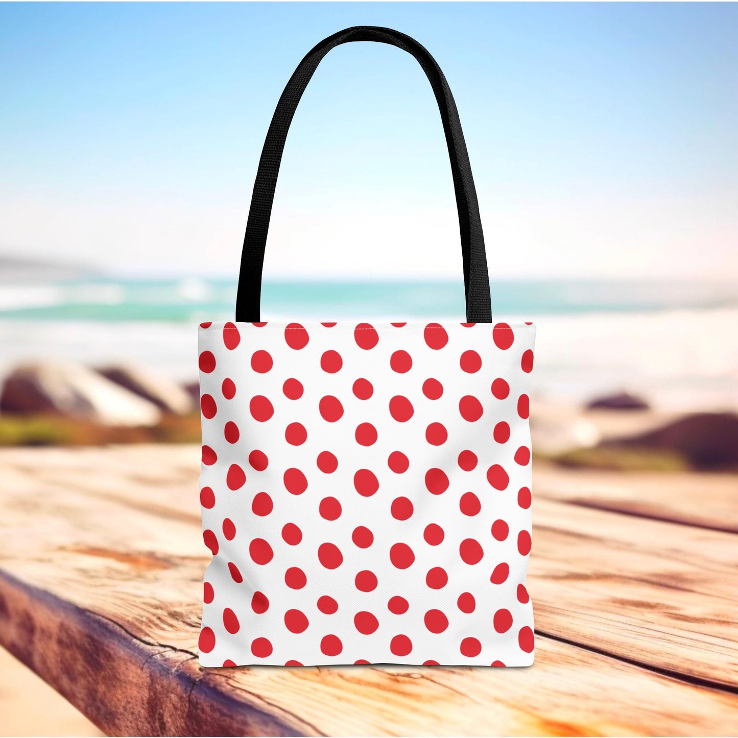 Red Polka Dots Tote Bag with a playful design, featuring a durable polyester body and reinforced handles, perfect for errands or beach outings. Available in various sizes, aligning with FireBrook Designs' joyful essentials.
