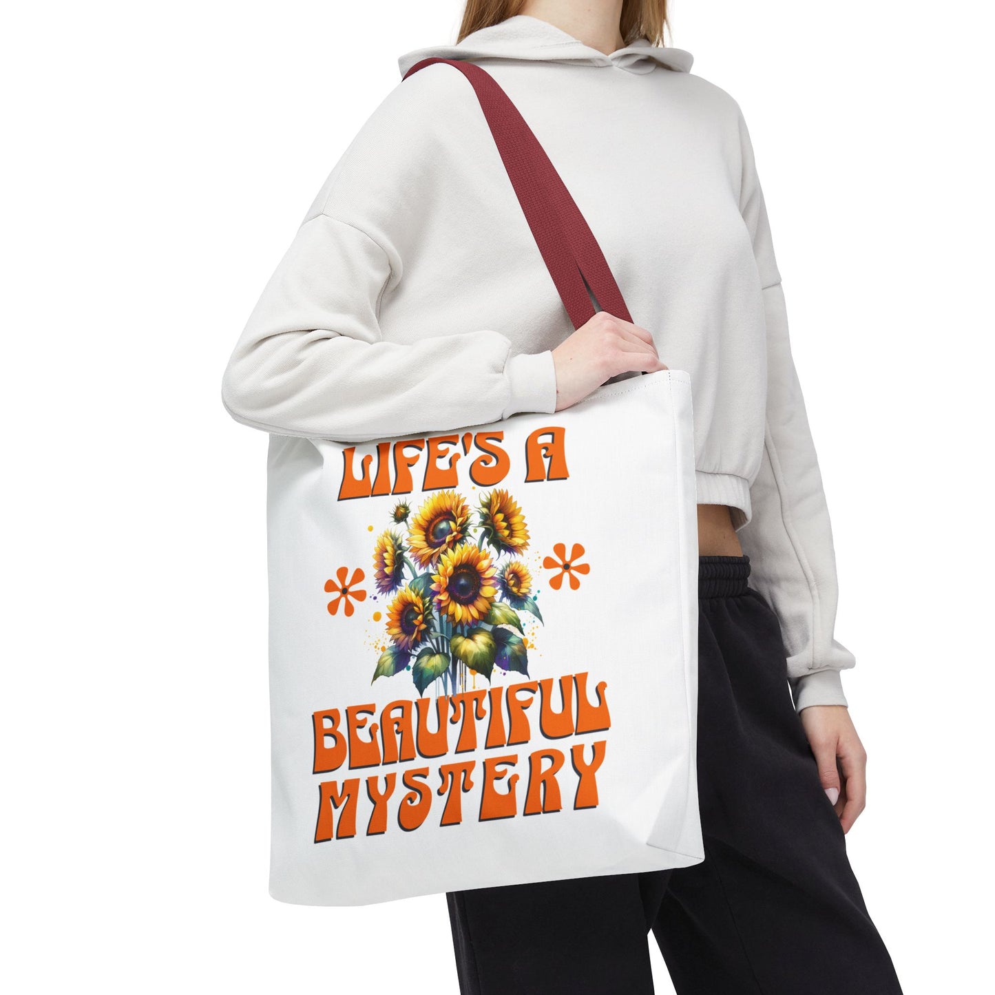 Life's A Beautiful Mystery Tote Bag held by a woman, showcasing its durable polyester build and reinforced handles, suited for daily adventures and gifting.