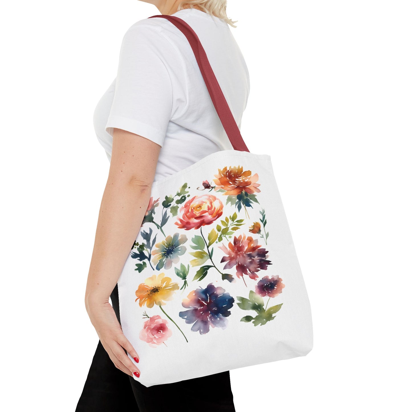 Watercolor Floral Tote Bag: A woman carries a stylish tote bag featuring a vibrant floral design, perfect for daily errands and outdoor adventures.