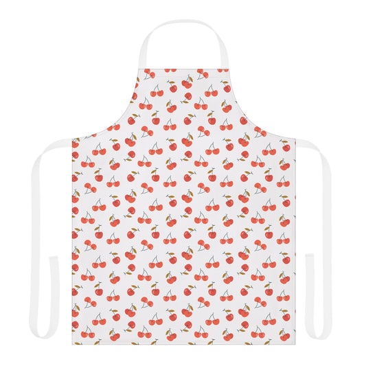 Cherries Apron from FireBrook Essentials showcases a white apron adorned with vibrant red cherry patterns, crafted from stain-resistant polyester canvas, featuring adjustable straps for versatile use in cooking and crafting.