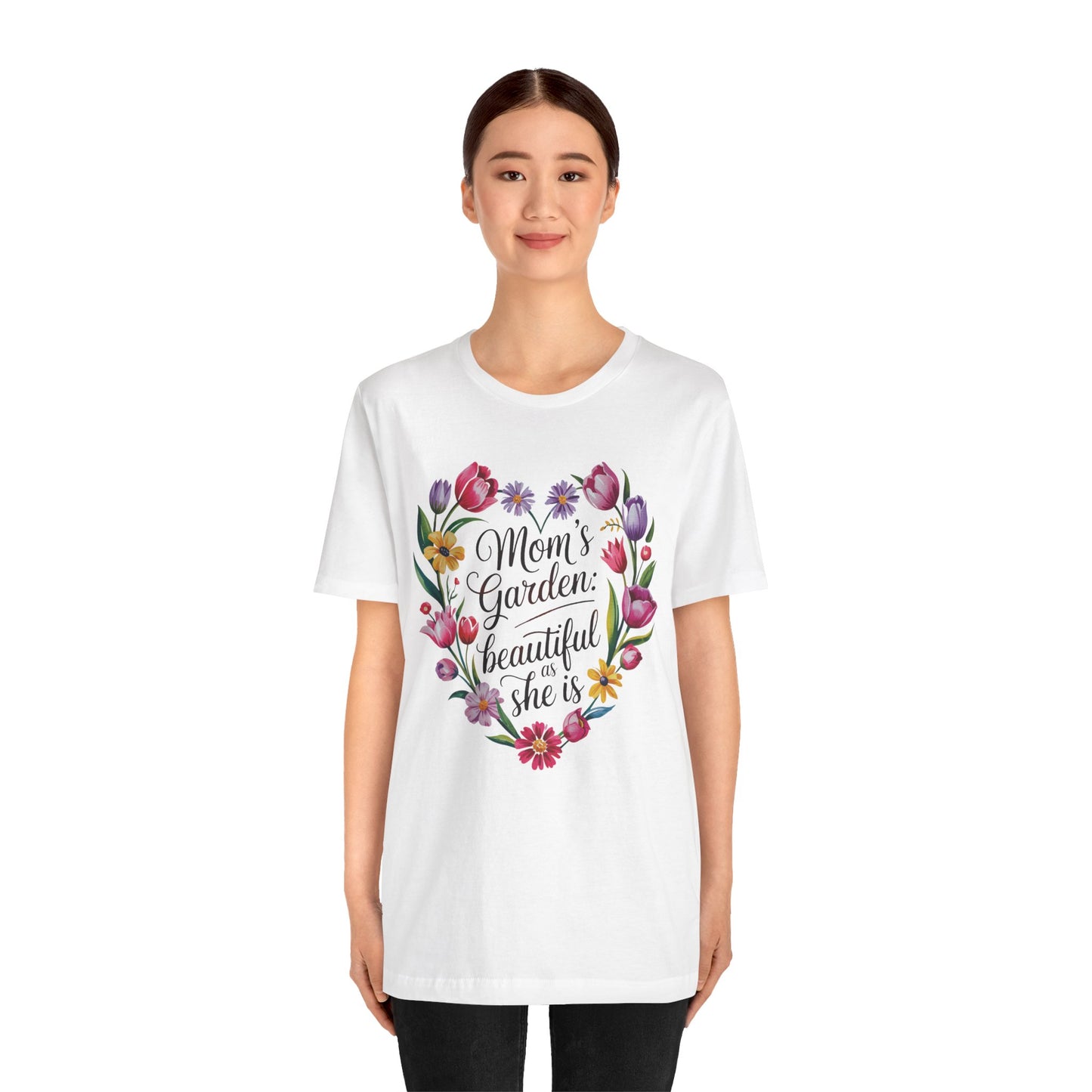 Mom's Garden is as Beautiful as She Is Mother's Day Comfort Colors Unisex T-Shirt, featuring a heart-shaped floral design, worn by a woman, embodying comfort and style. Perfect for celebrating special women.