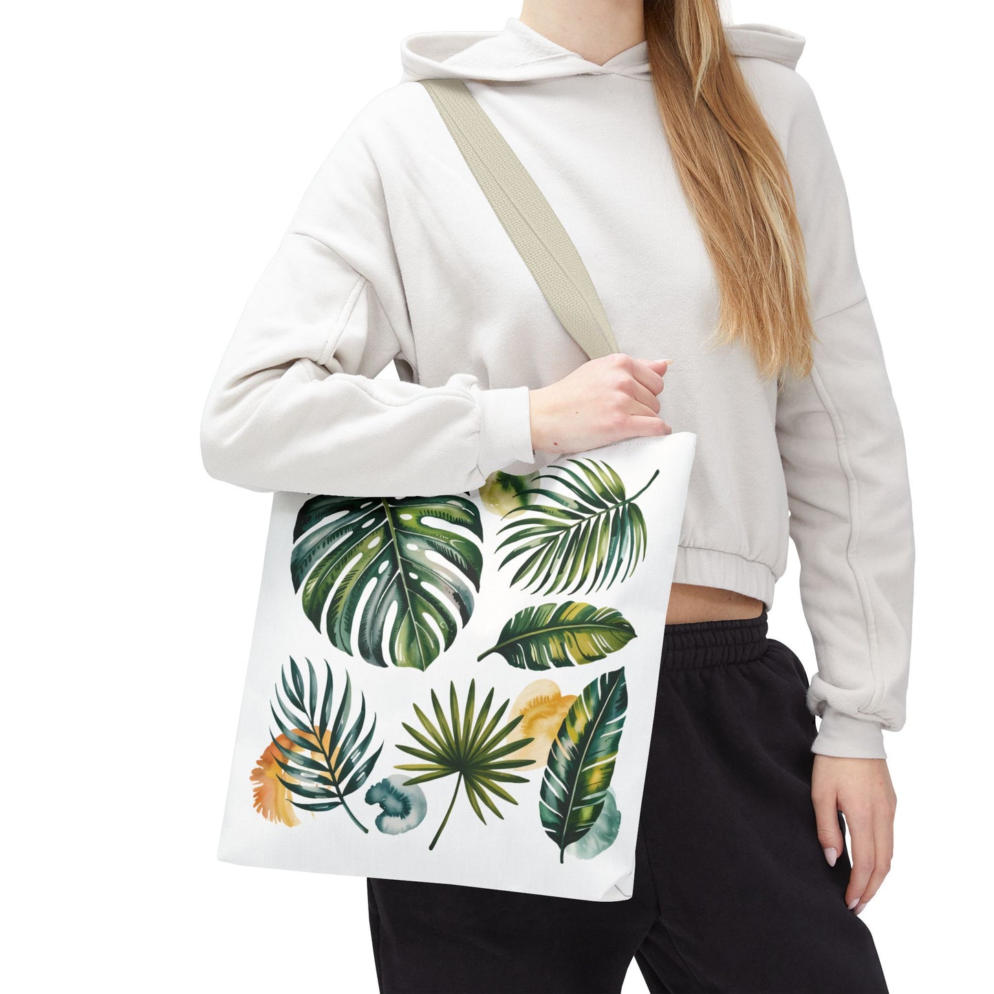 Tropical Leaves Tote Bag featuring a vibrant leaf pattern, highlighted in a close-up shot. Ideal for stylish, eco-conscious beach trips or shopping, embodying FireBrook Essentials' joyful and uplifting design ethos.