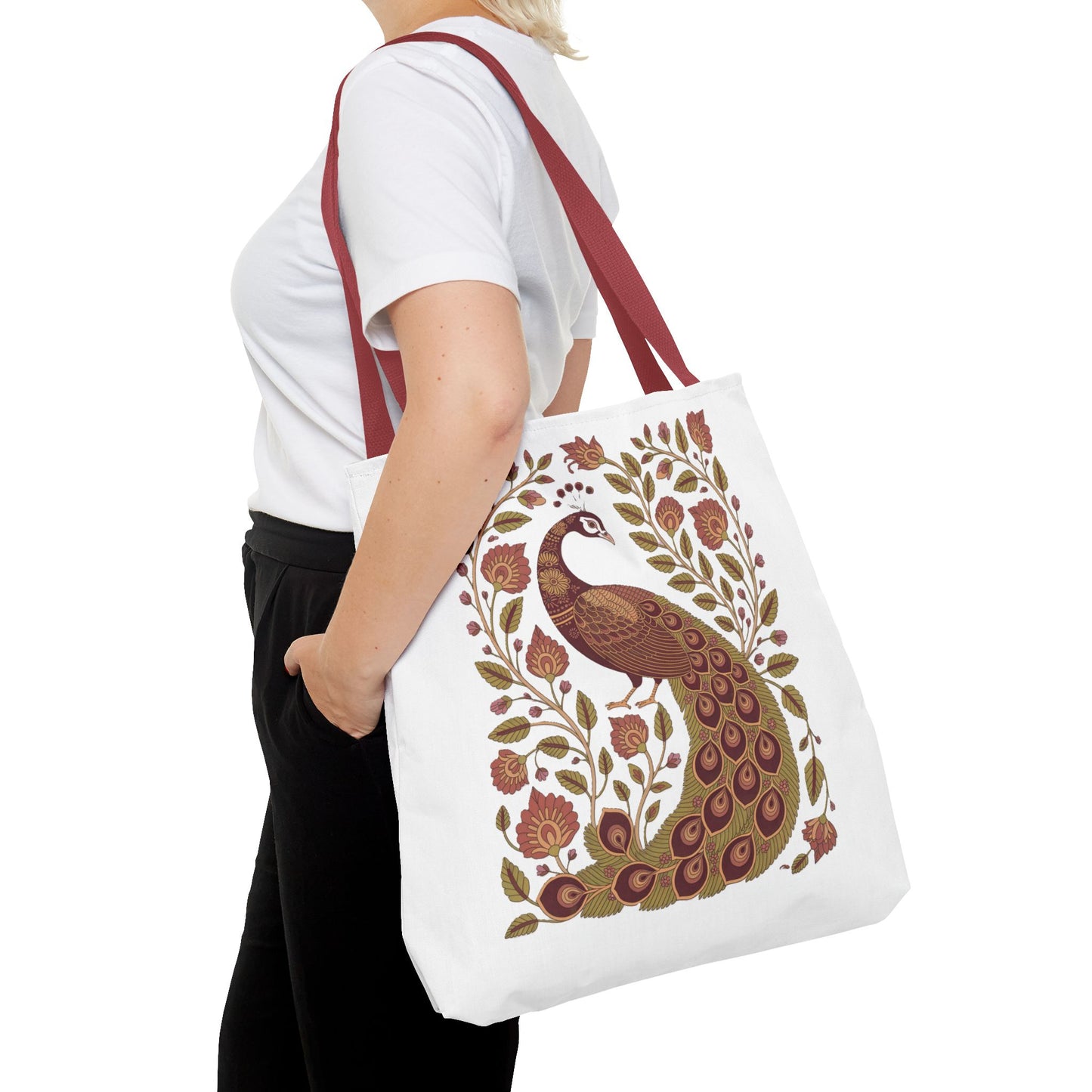 Peacock Tote Bag with Floral Vines and Paisley Motifs, held by a woman, showcases elegant design with peacock, floral vines, and paisley patterns, embodying FireBrook Essentials’ stylish, joyful approach to fashion accessories.