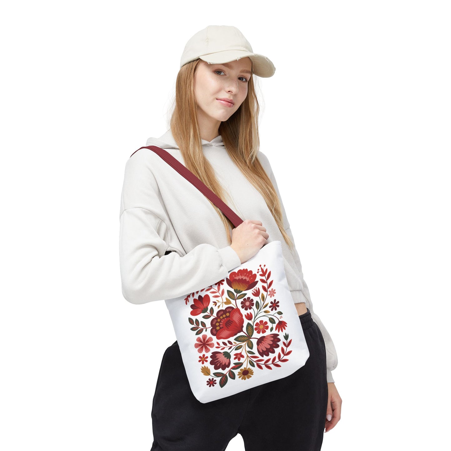Red Floral Folk-Art Style Tote Bag featuring lively organic floral illustrations in red tones with green leaves, perfect for carrying essentials. Ideal for nature lovers and art enthusiasts seeking unique, vibrant designs.