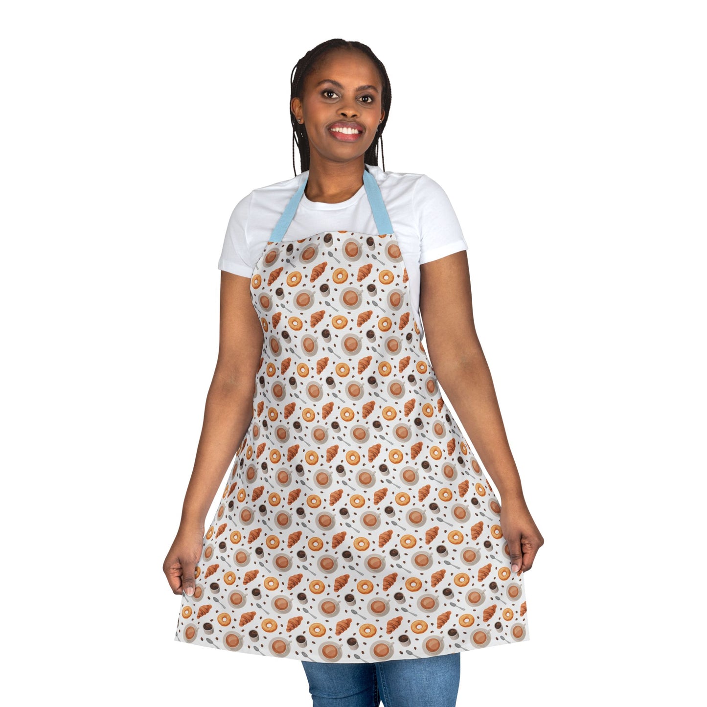 A woman wears the Apron Coffee Cups Donuts Croissants Beans Spoon, showcasing its playful design of coffee-themed icons. Ideal for enthusiastic bakers or hosts, this apron combines comfort with vibrant, joyful patterns.