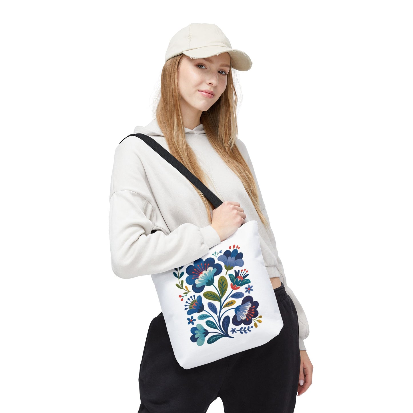 Vintage Folk Art Design Blue Floral Tote Bag featuring charming, nostalgic floral patterns. Durable and spacious with reinforced handles, it’s perfect for everyday use or special occasions, embodying FireBrook Essentials' uplifting, unique style.