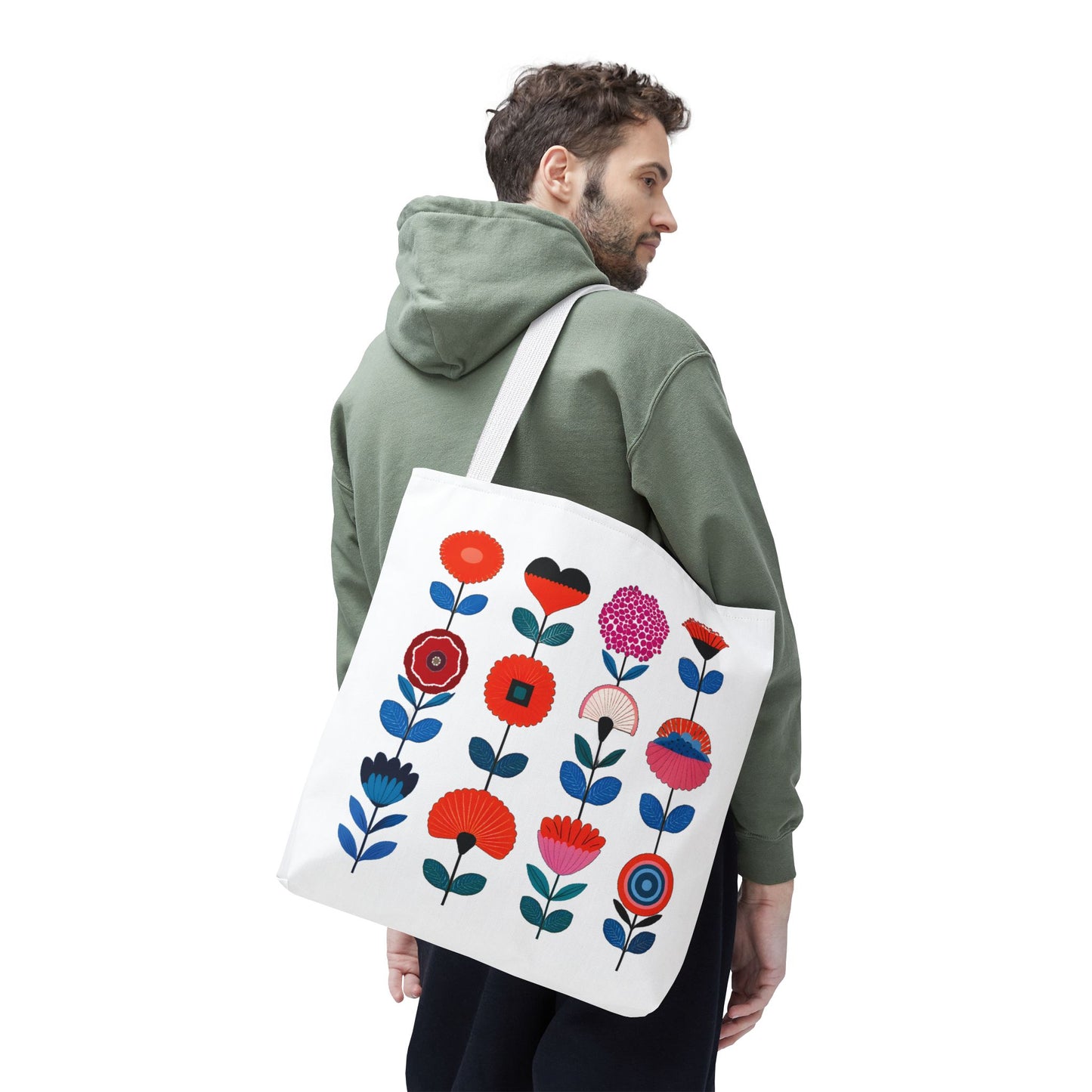 Floral Pattern Tote Bag carried by a person in a green jacket, showcasing colorful flowers and sturdy design, perfect for stylish, everyday use.