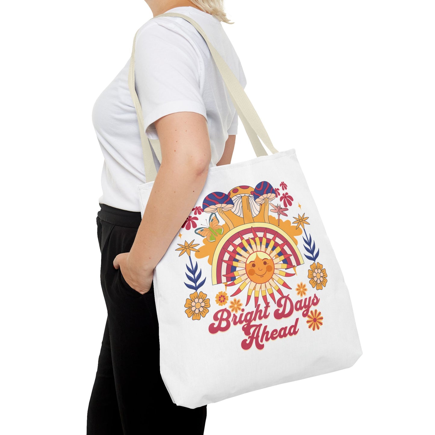 Bright Days Ahead Sunshine Floral Tote Bag adorned with sunshine, flowers, and butterflies, ideal for uplifting outdoor adventures. Features durable polyester, reinforced handles, and spacious boxed corners, available in multiple sizes.