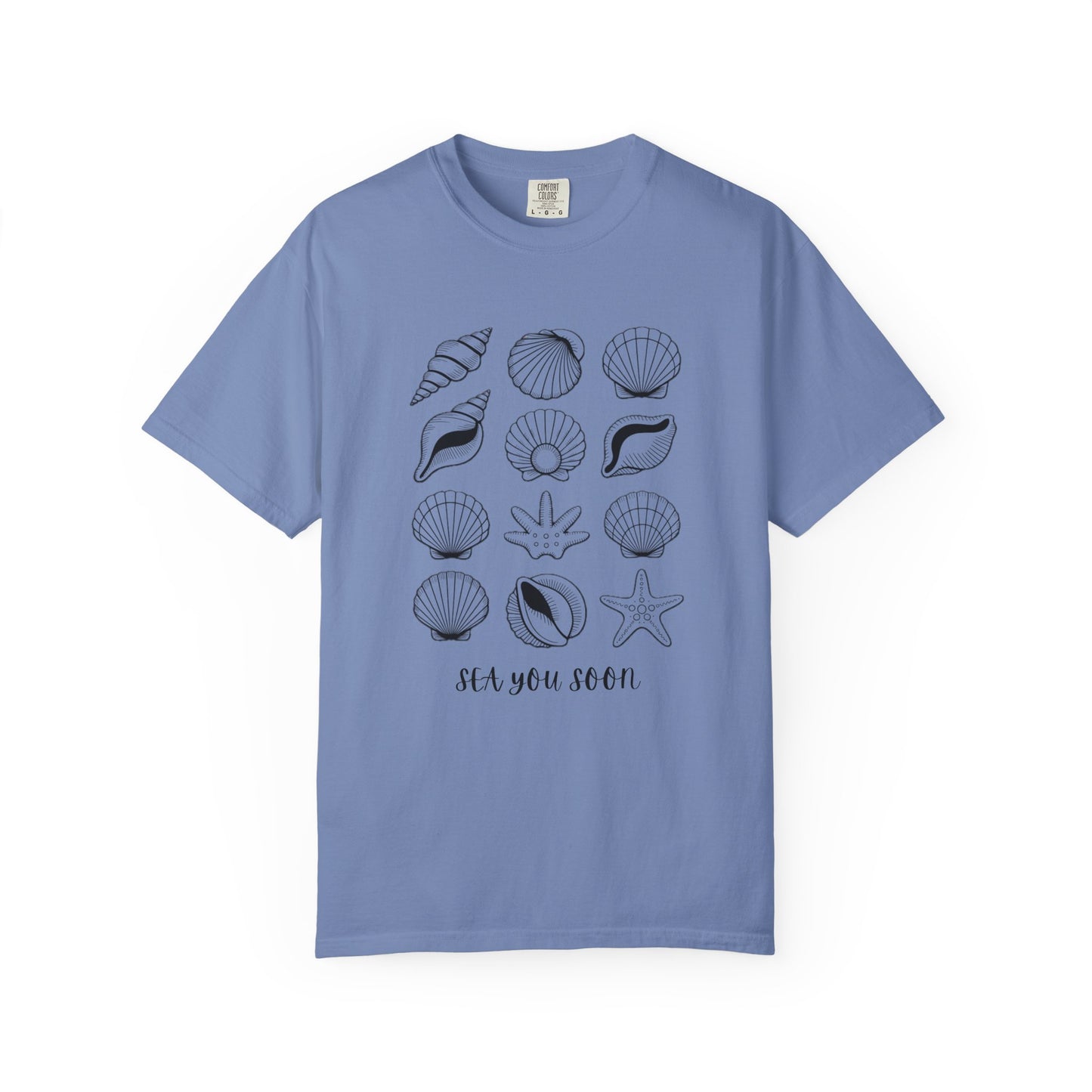 Seashells and Sea You Soon T-Shirt, showcasing a relaxed fit with seashell motifs and beach-themed text, embodying FireBrook Essentials' uplifting and joyful style, perfect for ocean enthusiasts seeking comfort and durability.