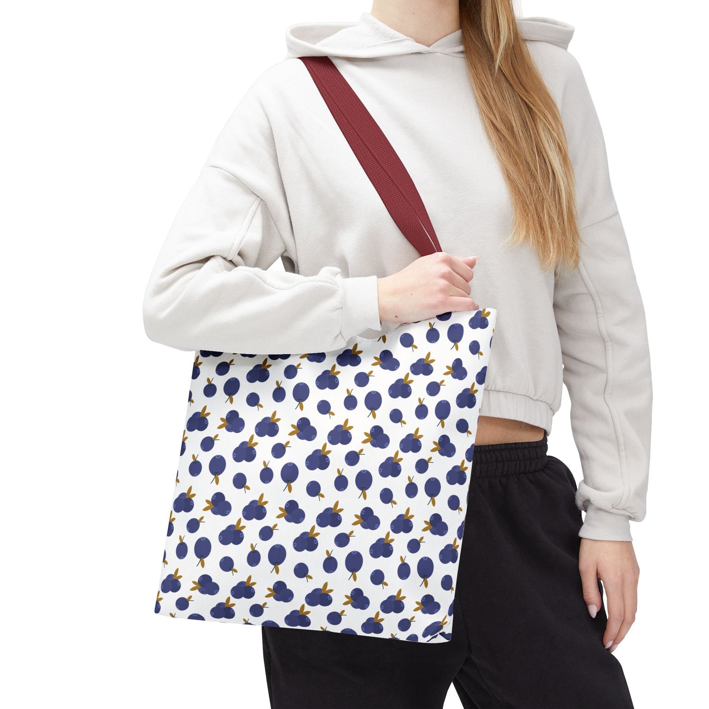 Blueberry Tote Bag showcasing a charming blueberry pattern, crafted from durable polyester with reinforced handles and boxed corners, perfect for carrying essentials stylishly while embodying FireBrook Designs' uplifting and joyful ethos.