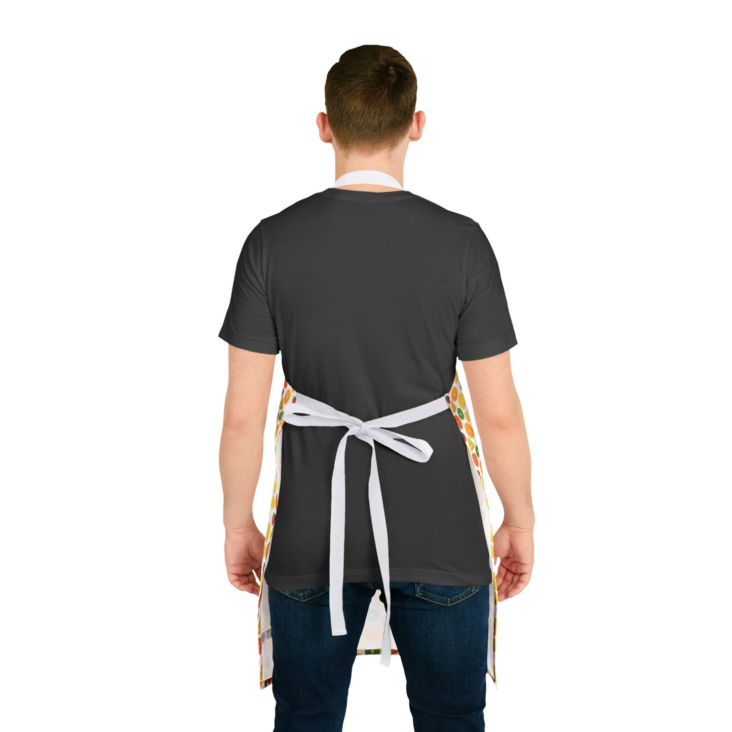 Man wearing the Apron, Fruit Slices Pattern, 5-Color Straps, showcasing vibrant design on a black surface, ideal for cooking or crafting, embodying FireBrook Designs' ethos of stylish, joyful living.
