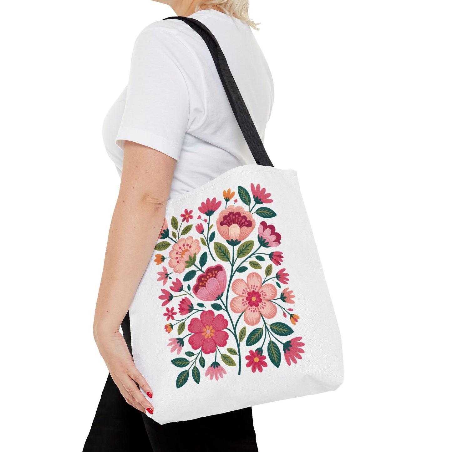 Pink Floral Folk-Art Style Tote Bag with vibrant organic floral illustrations in pink tones, featuring soft blush and magenta flowers, complemented by dusty green leaves, ideal for everyday use.