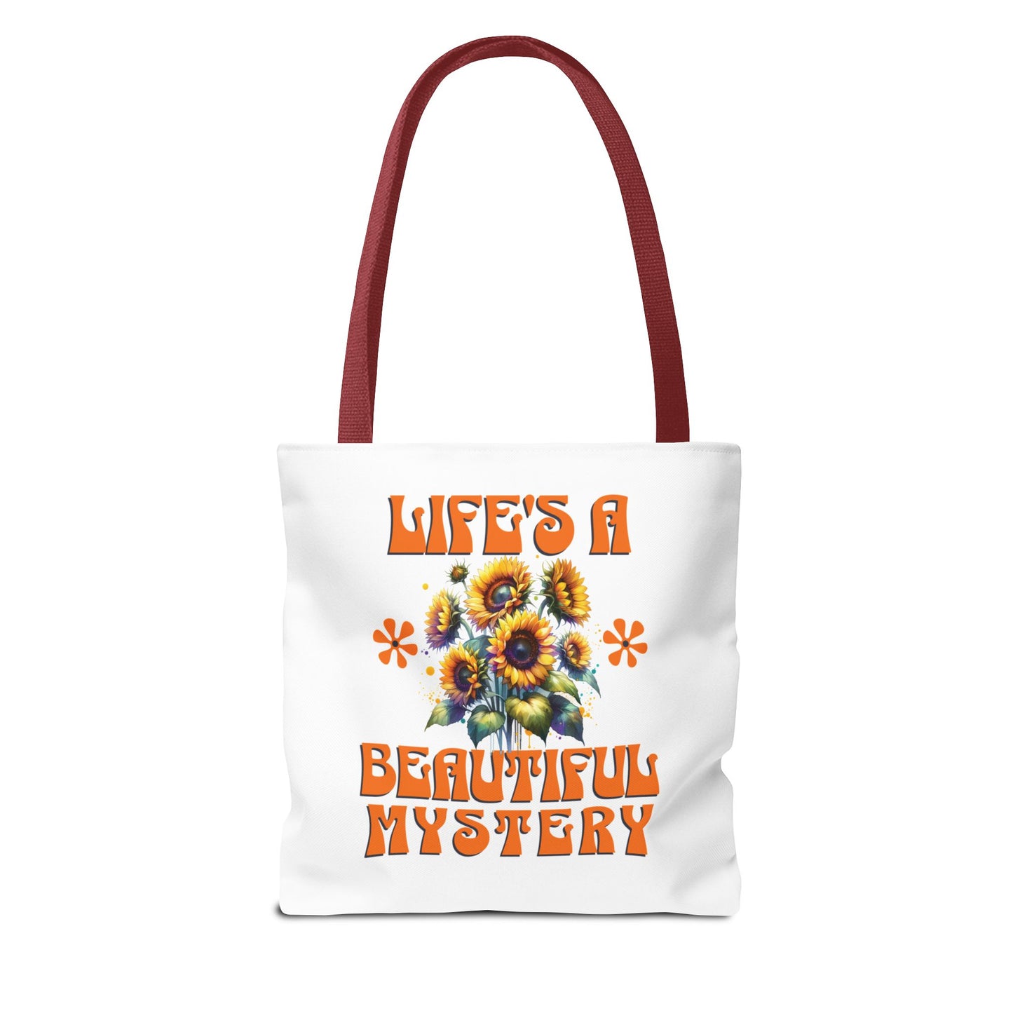 Life's A Beautiful Mystery Tote Bag with orange and yellow floral pattern, featuring a durable polyester body and reinforced handles for stylish, everyday use.