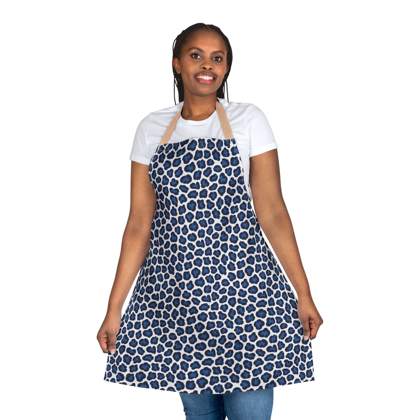 Apron, Cheetah Print: A close-up of a woman wearing a stylish blue cheetah print apron, showcasing its soft texture and tie-back closure, ideal for adding fun and protection during cooking or crafting.
