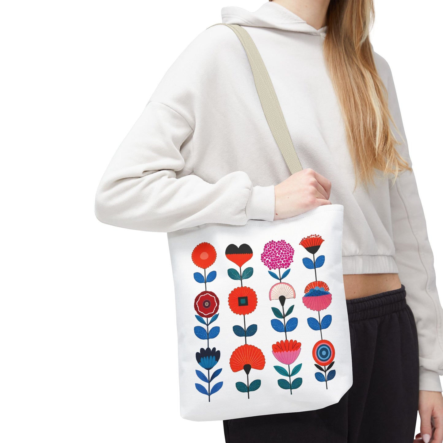 Floral Pattern Tote Bag: Woman holding a white tote with vibrant floral design, ideal for everyday use, embodying style and functionality from FireBrook Essentials.