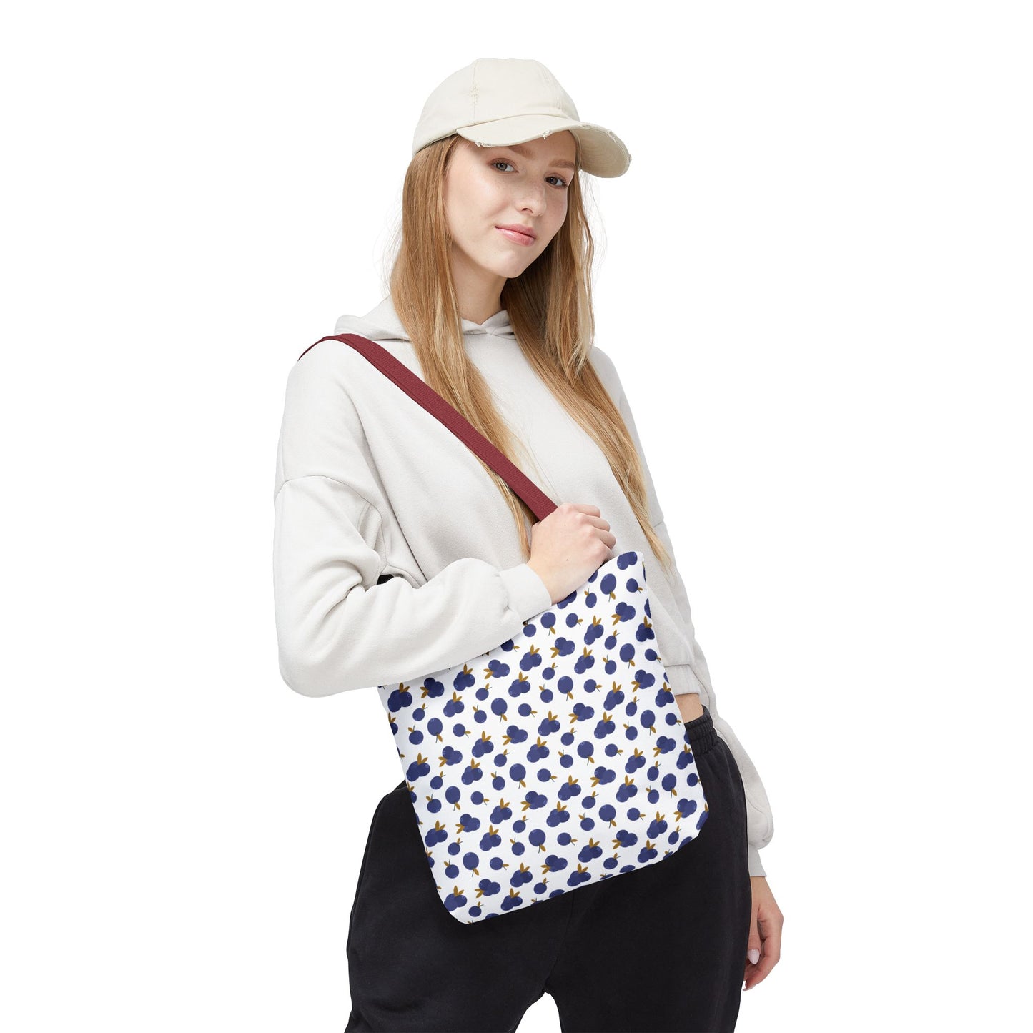 Blueberry Tote Bag showcasing a delightful blueberry pattern; crafted from durable polyester with reinforced black stitching and boxed corners for added space, perfect for stylish, everyday use.