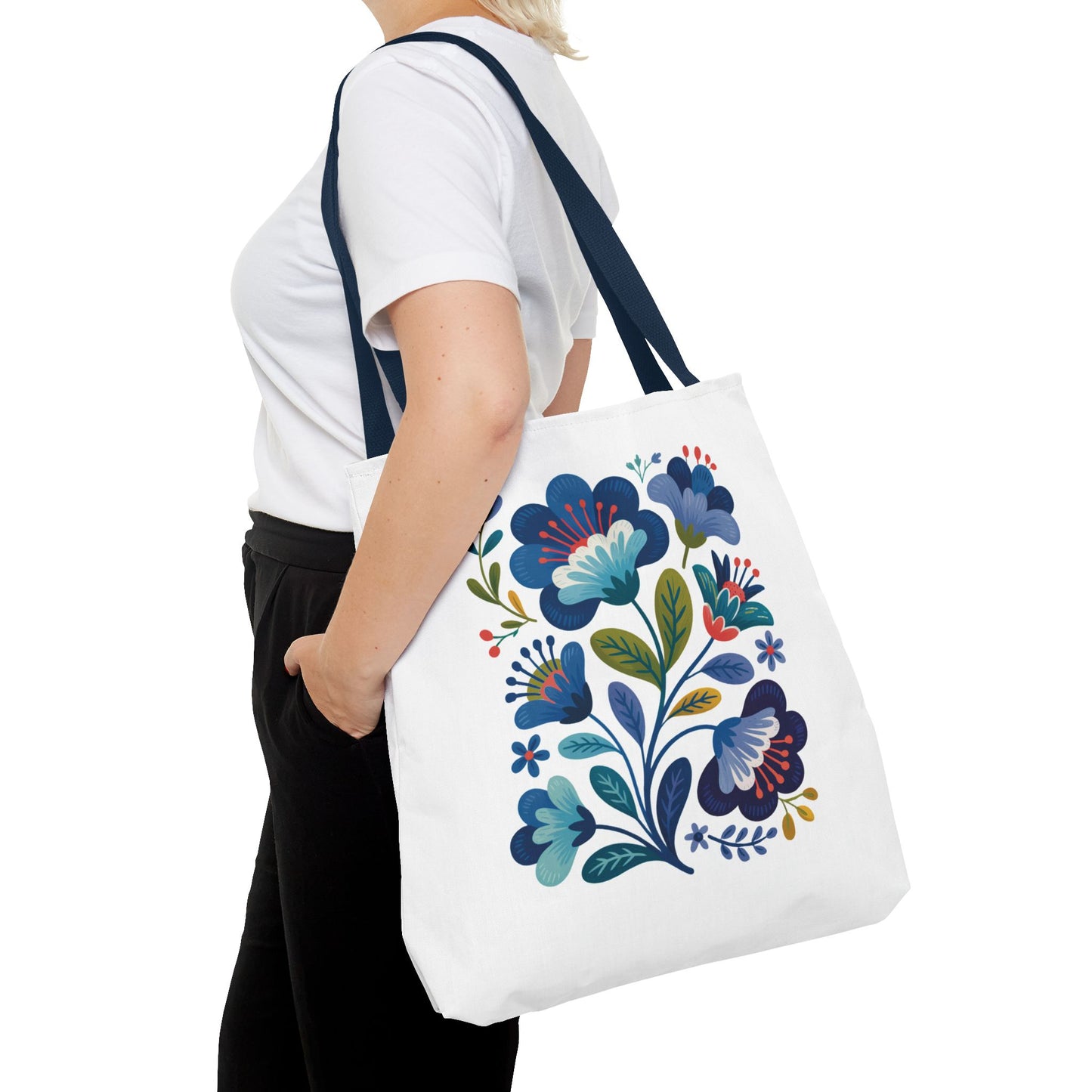 Vintage Folk Art Design Blue Floral Tote Bag featuring charming folk art florals, ideal for everyday use or special occasions. Made from durable polyester with reinforced handles, offering both style and practicality.