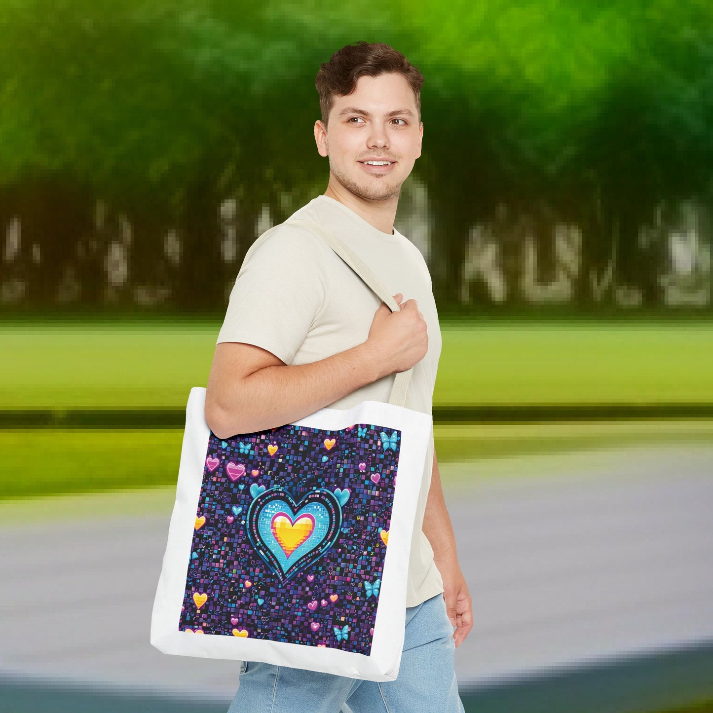 Man smiling, holding a Heart Pixelated Nostalgic Cyber-Aesthetic Tote Bag, featuring pixelated hearts and butterflies, embodying a trendy, Y2K-inspired design from FireBrook Essentials.