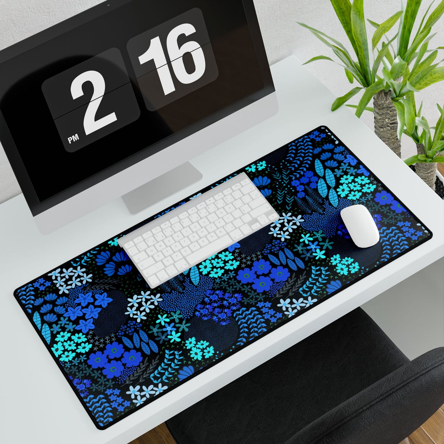 Blue Floral Desk Mat enhances a minimalist workspace with its elegant floral design. Positioned under a white keyboard and mouse, it adds vibrant charm, perfect for uplifting any office or home desk.