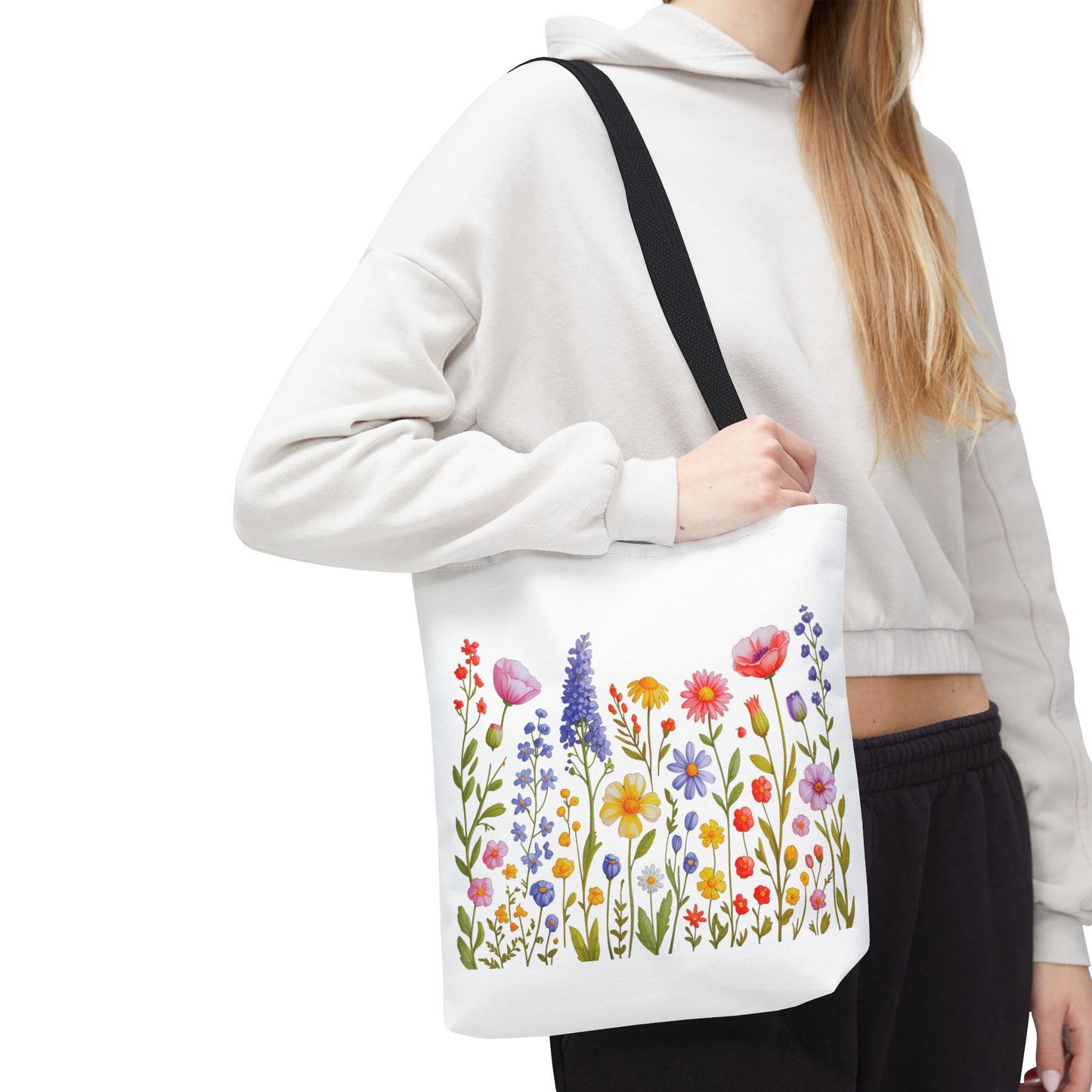 Wildflowers Tote Bag featuring a vibrant wildflower design, embodying a free-spirited vibe. Perfect for everyday use with durable polyester, reinforced handles, and available in three sizes for versatile functionality.